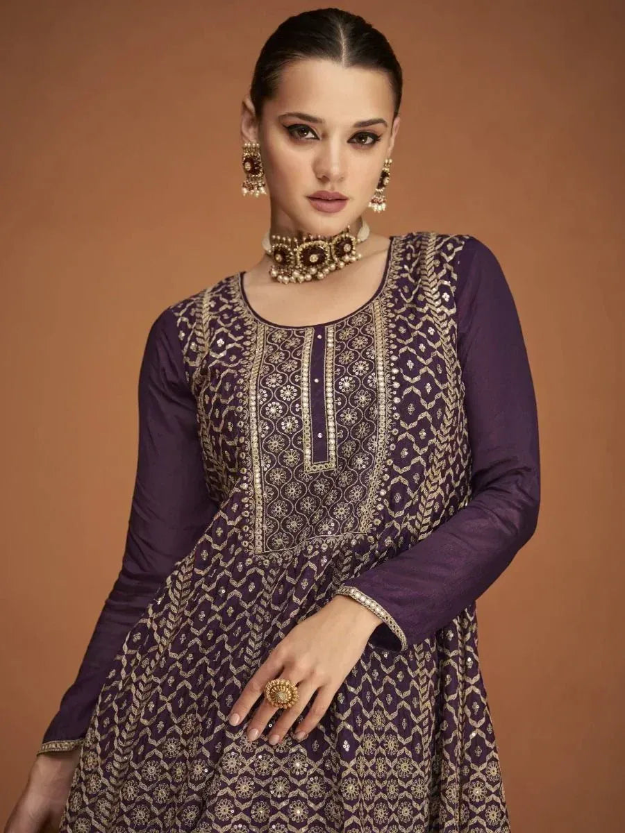 Purple embroidered ethnic anarkali gown with gold detailing, perfect for Indian festive occasions.