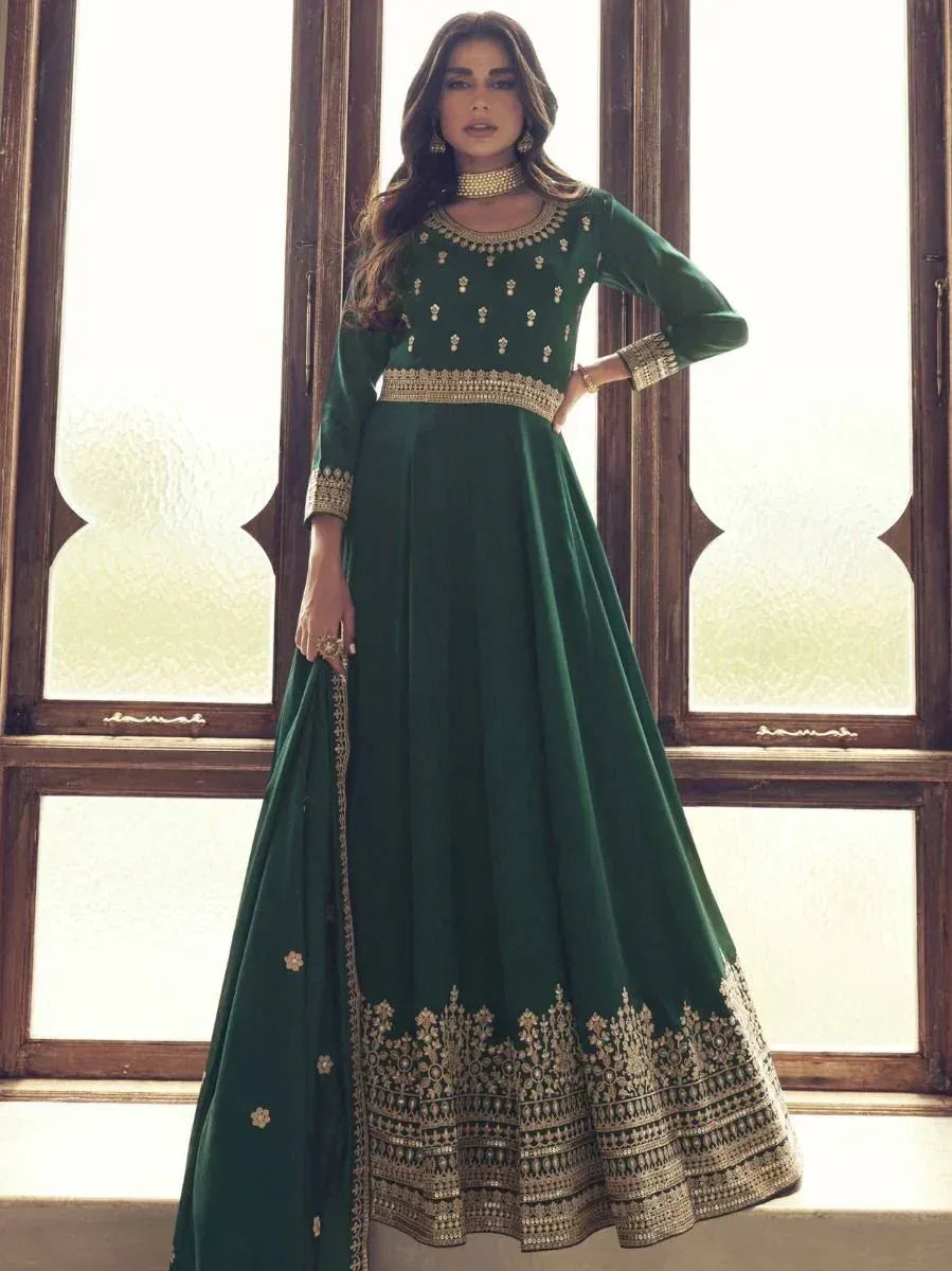 Emerald green designer anarkali with gold embroidery, perfect for Indian ethnic wear and festive occasions.