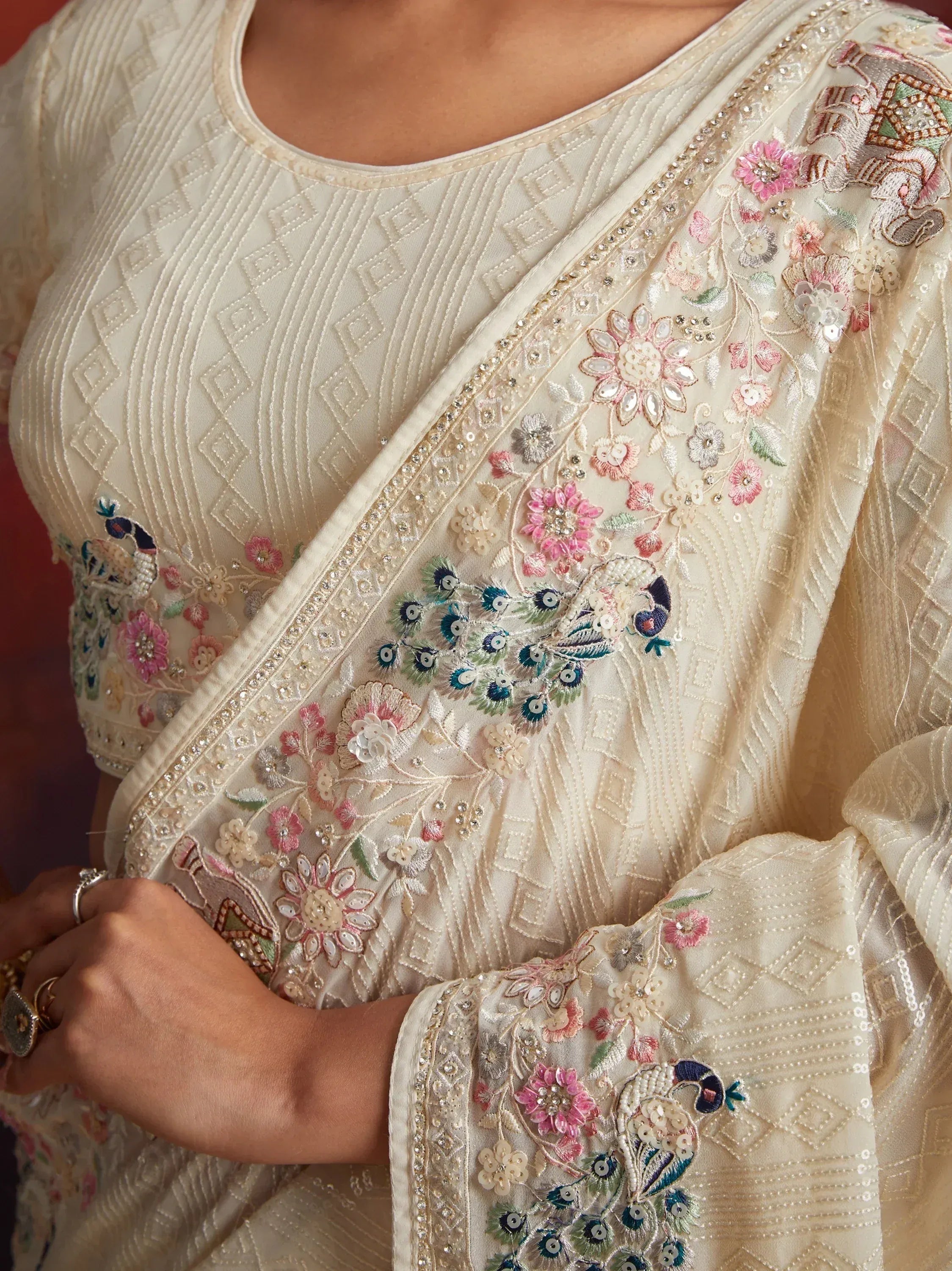 Cream ethnic wear with floral and peacock embroidery, perfect for Indian occasions