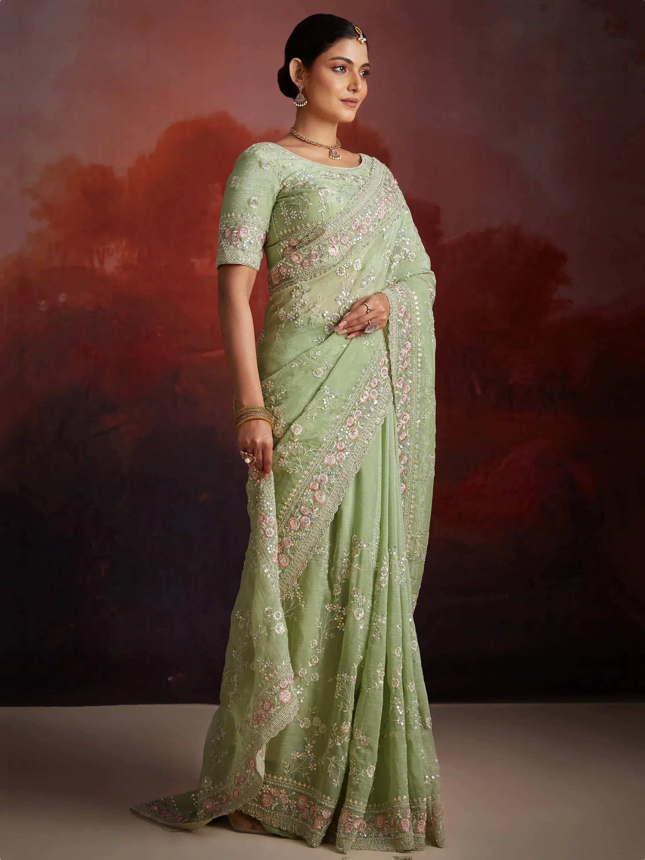 Mint green embroidered saree with floral zari work, perfect for Indian ethnic wear occasions
