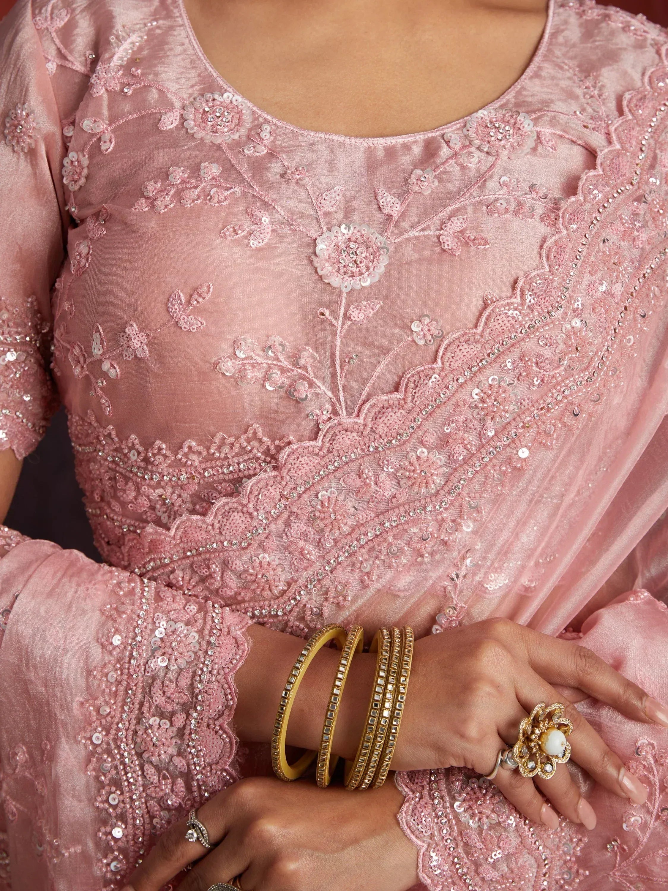 Pink velvet salwar kameez with floral sequin embroidery and gold bangles, Indian ethnic wear