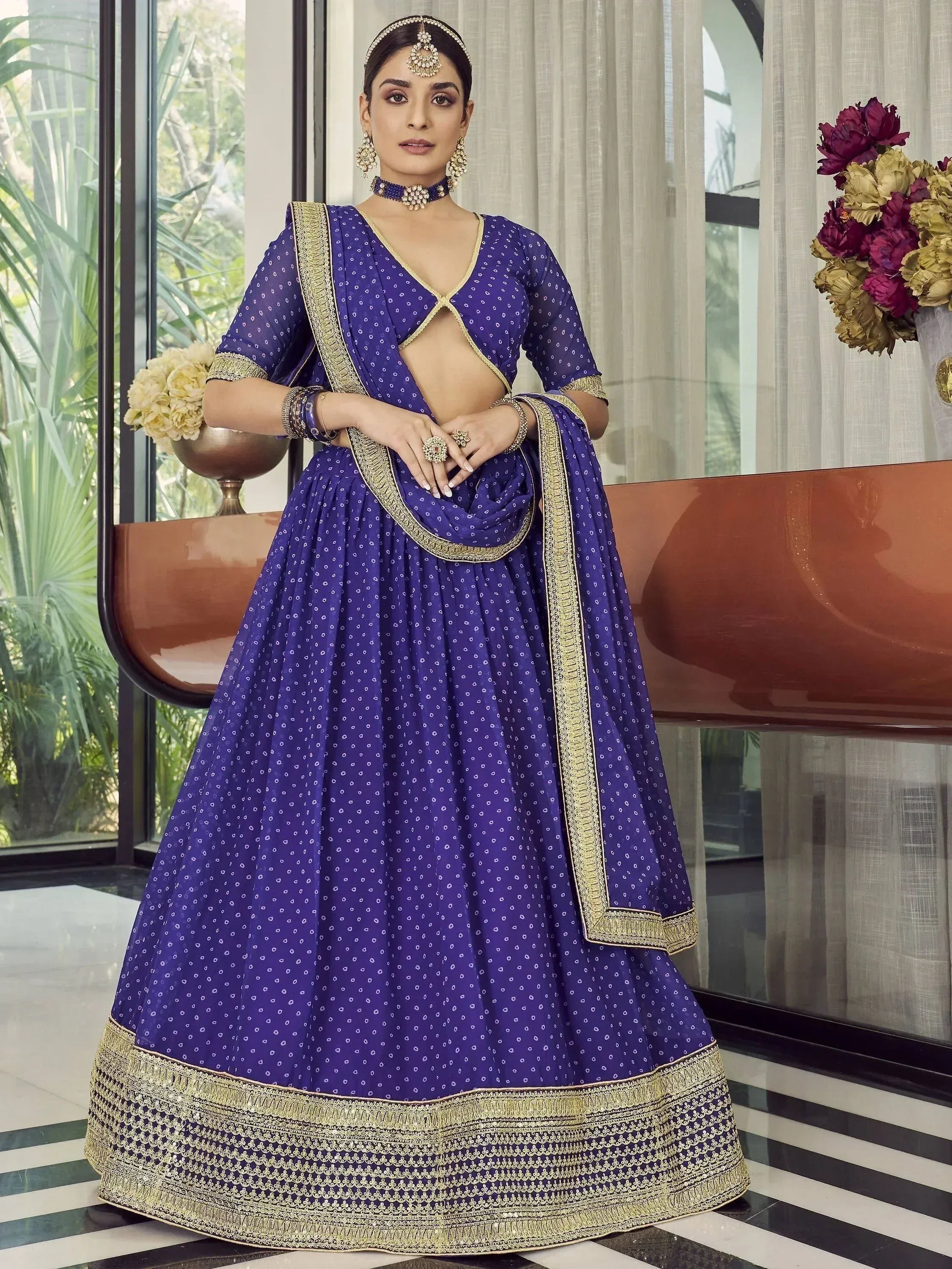 Royal blue lehenga choli with gold embroidery, perfect for Indian weddings and festive occasions