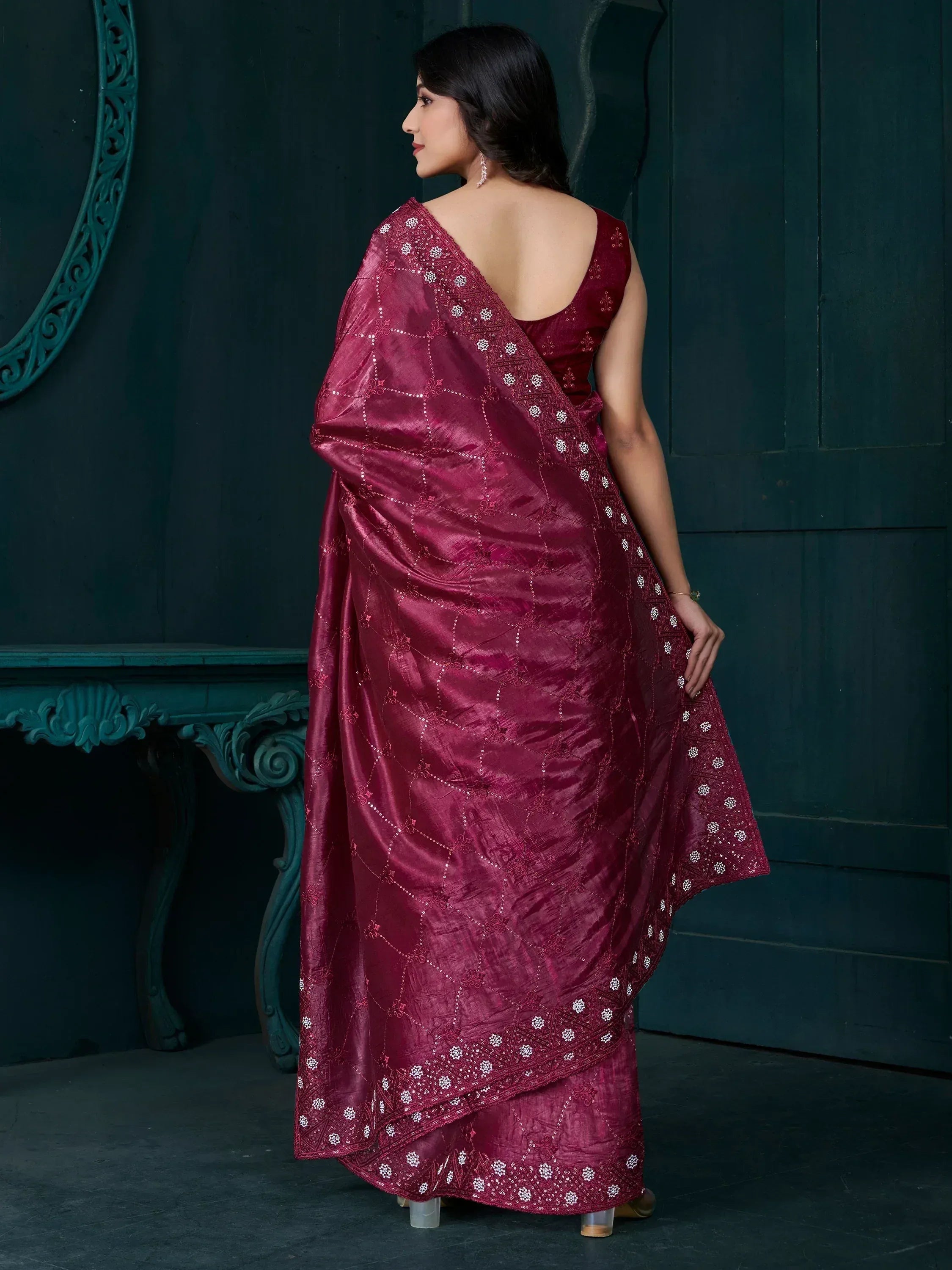 Elegant maroon saree with intricate white embroidery and geometric patterns, perfect for ethnic occasions.