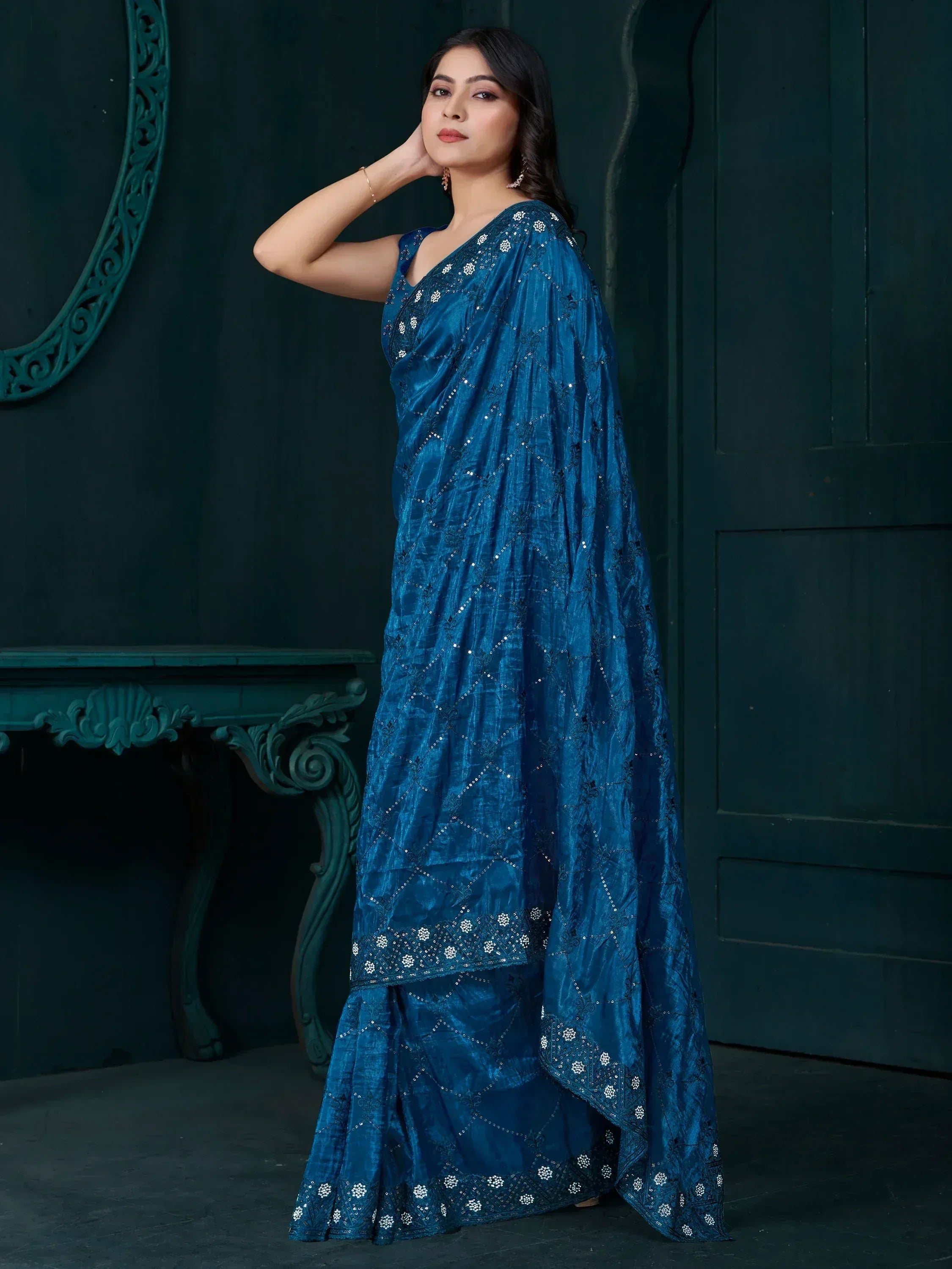 Elegant blue embroidered saree with intricate detailing, perfect for Indian ethnic wear occasions.