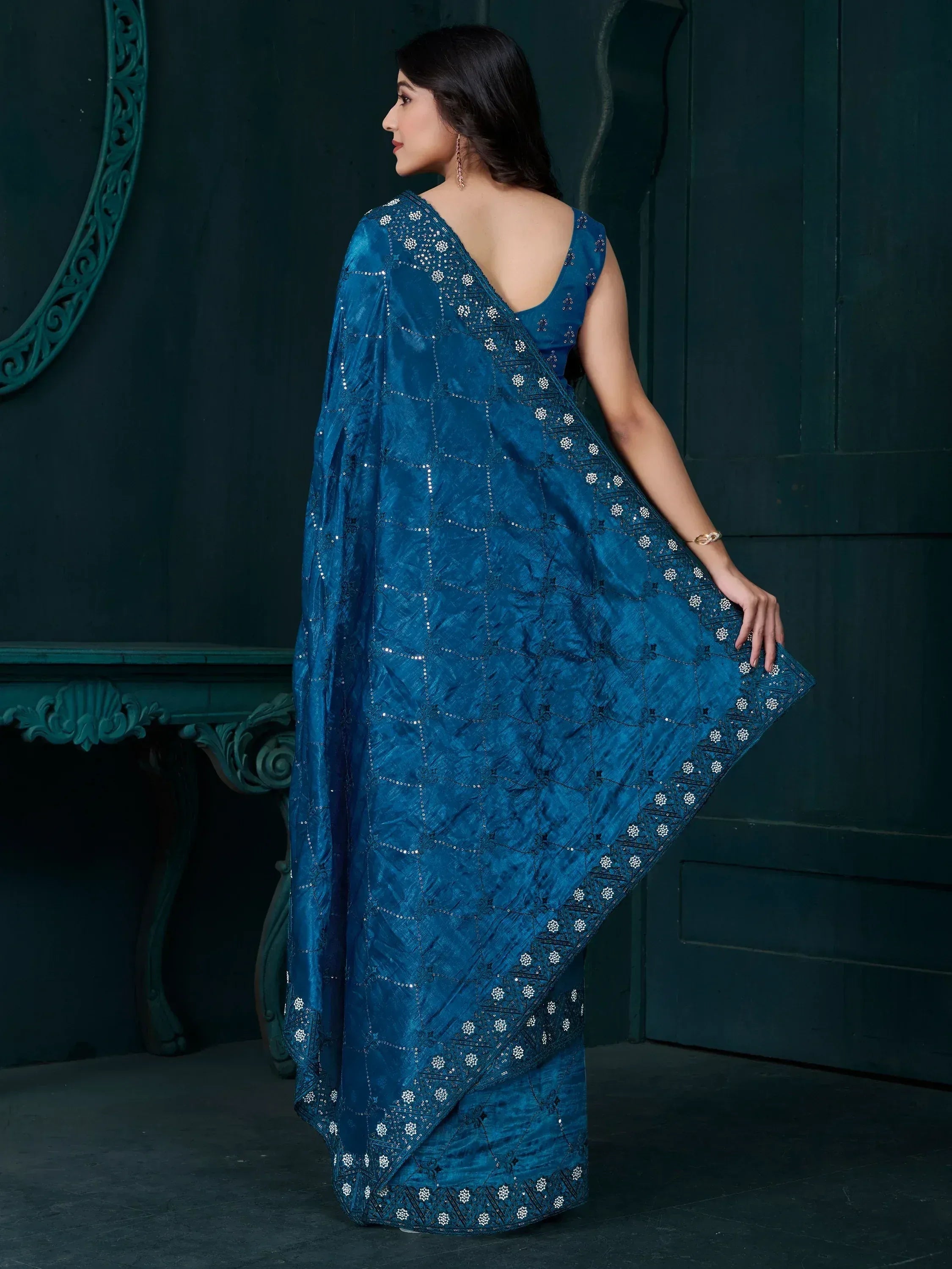 Elegant blue designer saree with intricate embroidery and sequins, perfect for ethnic occasions.