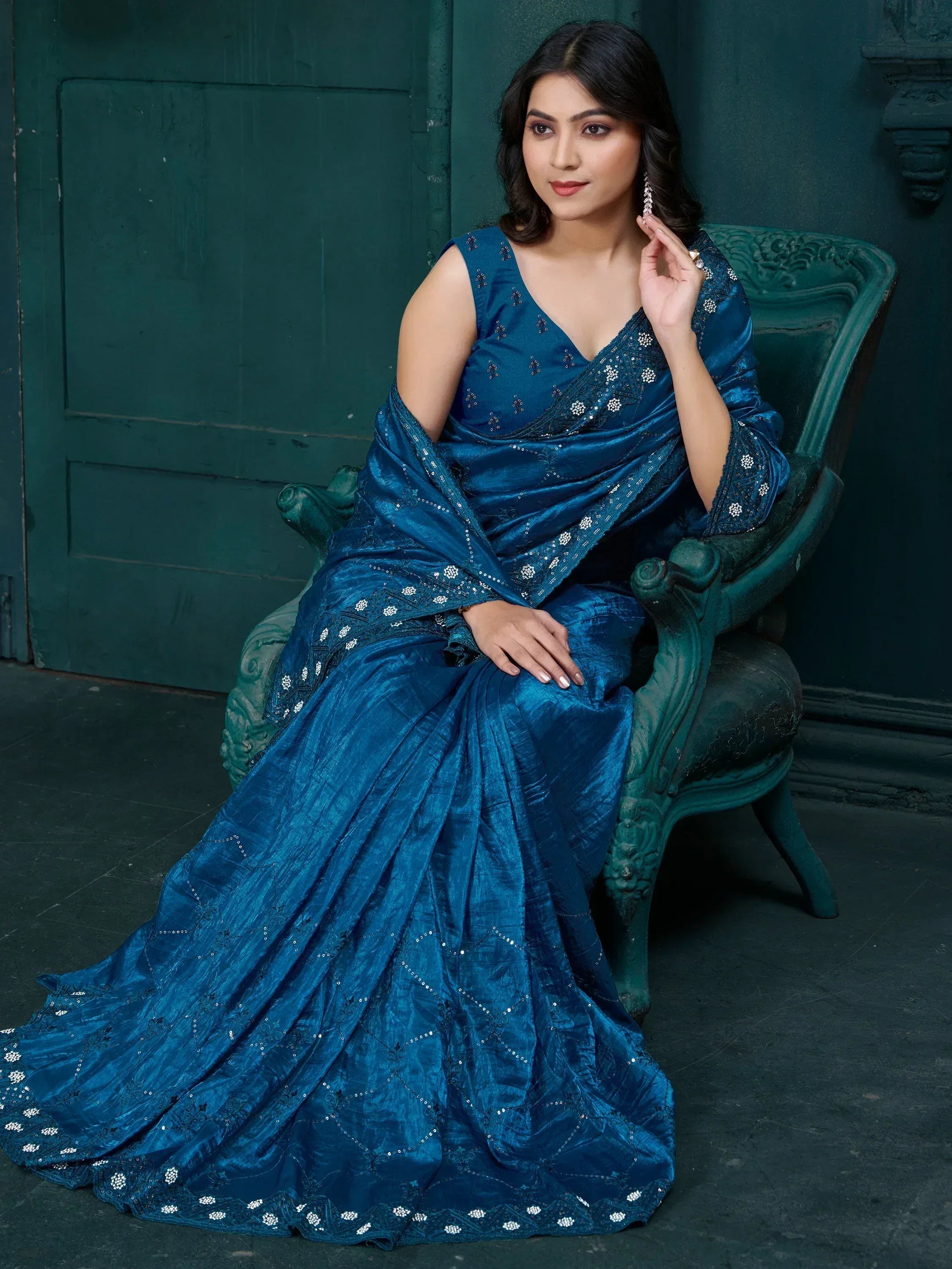 Elegant blue designer saree with intricate embroidery and sequins, perfect for ethnic occasions.