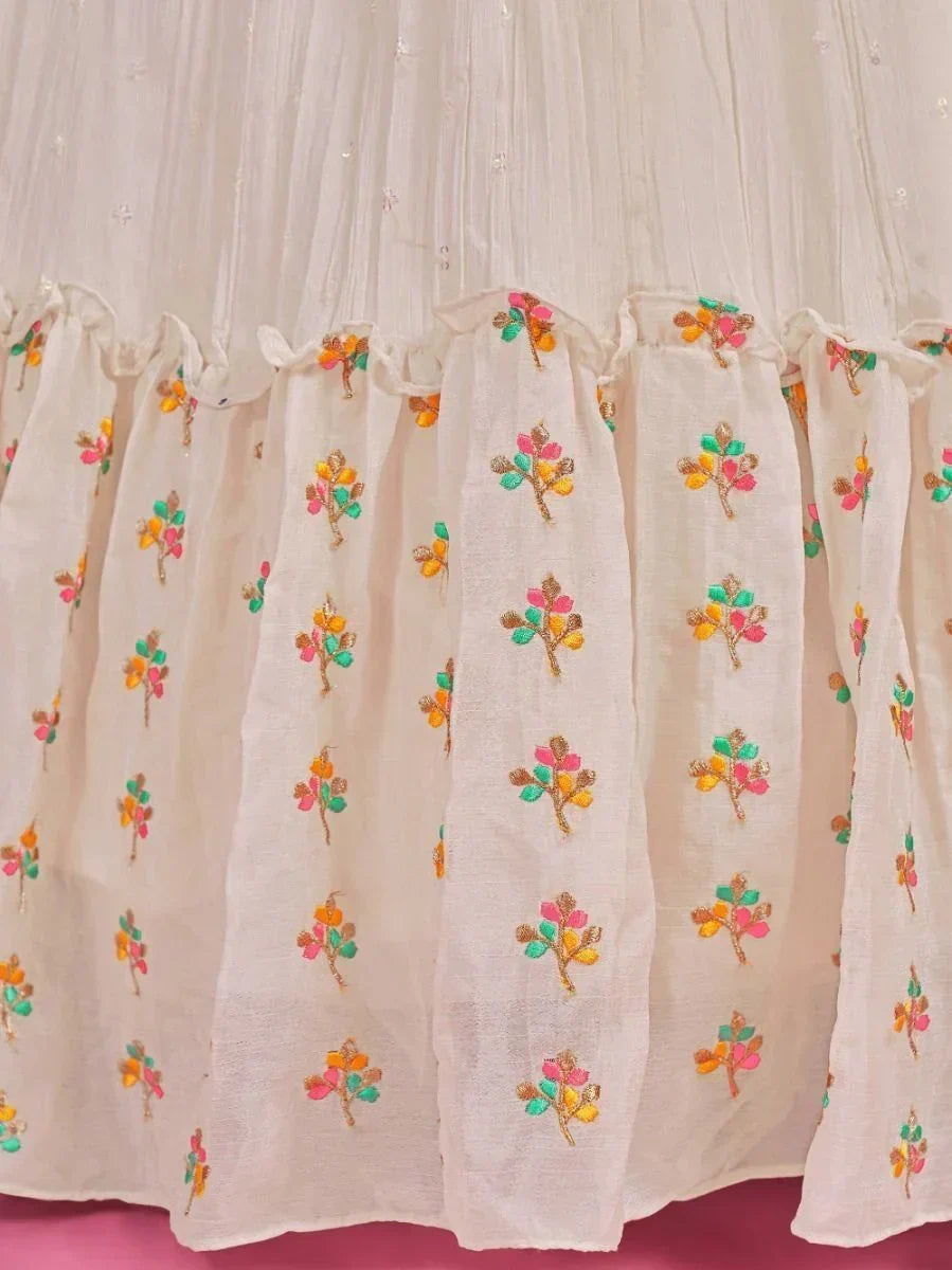 Off-white ethnic lehenga skirt with colorful floral embroidery and pleated detailing