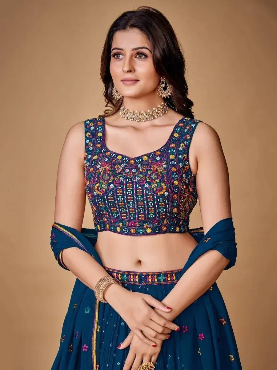 Blue embroidered lehenga choli with floral motifs, perfect for Indian ethnic wear occasions