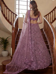 Impressive Purple Sequins Net Reception Wear Lehenga Choli