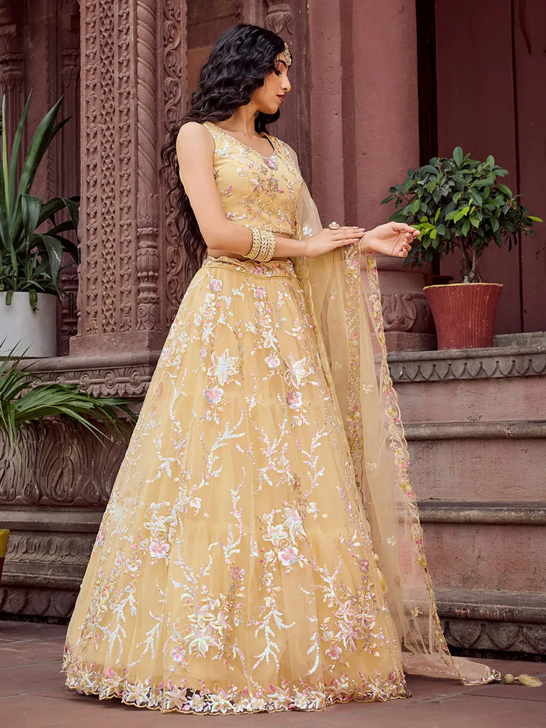Gleaming Yellow Sequins Embroidered Net Wedding Wear Lehenga Choli