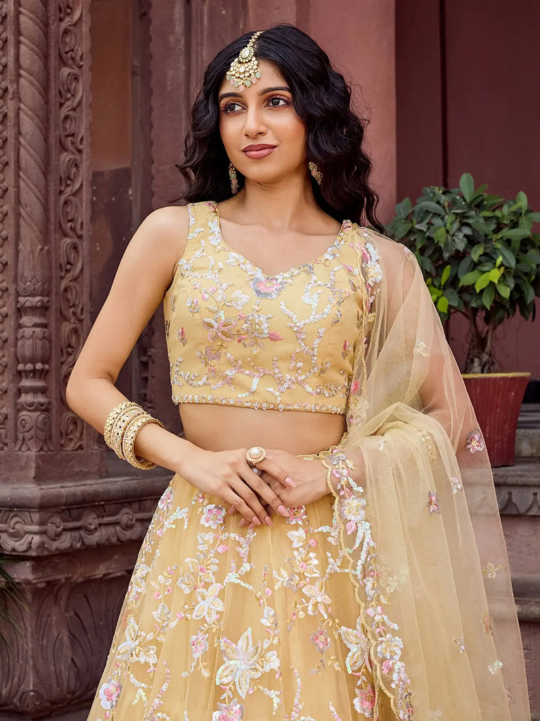 Gleaming Yellow Sequins Embroidered Net Wedding Wear Lehenga Choli
