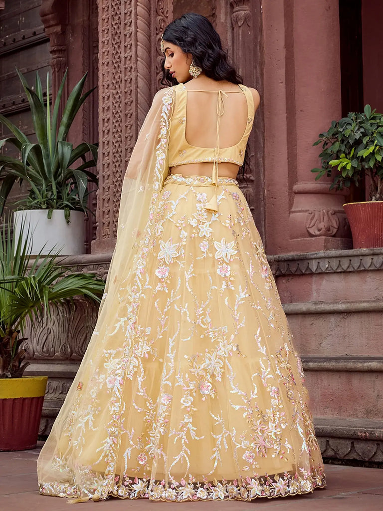 Gleaming Yellow Sequins Embroidered Net Wedding Wear Lehenga Choli
