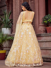 Gleaming Yellow Sequins Embroidered Net Wedding Wear Lehenga Choli