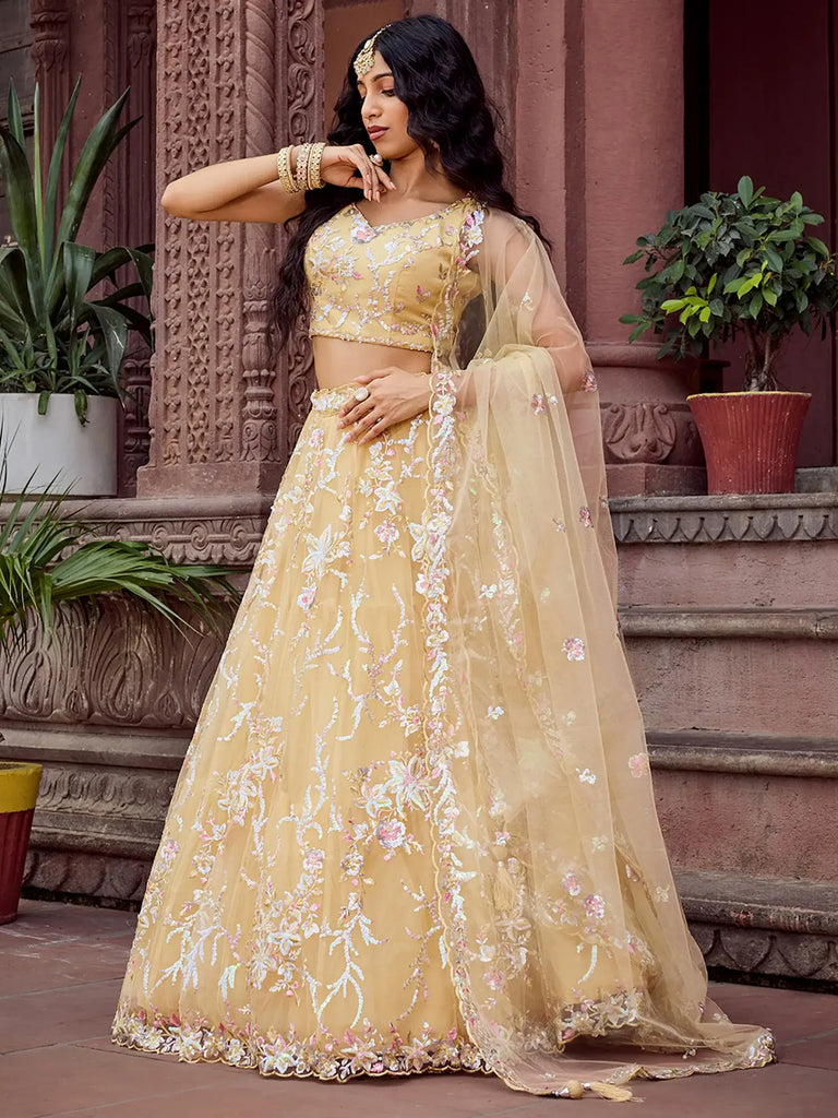 Gleaming Yellow Sequins Embroidered Net Wedding Wear Lehenga Choli
