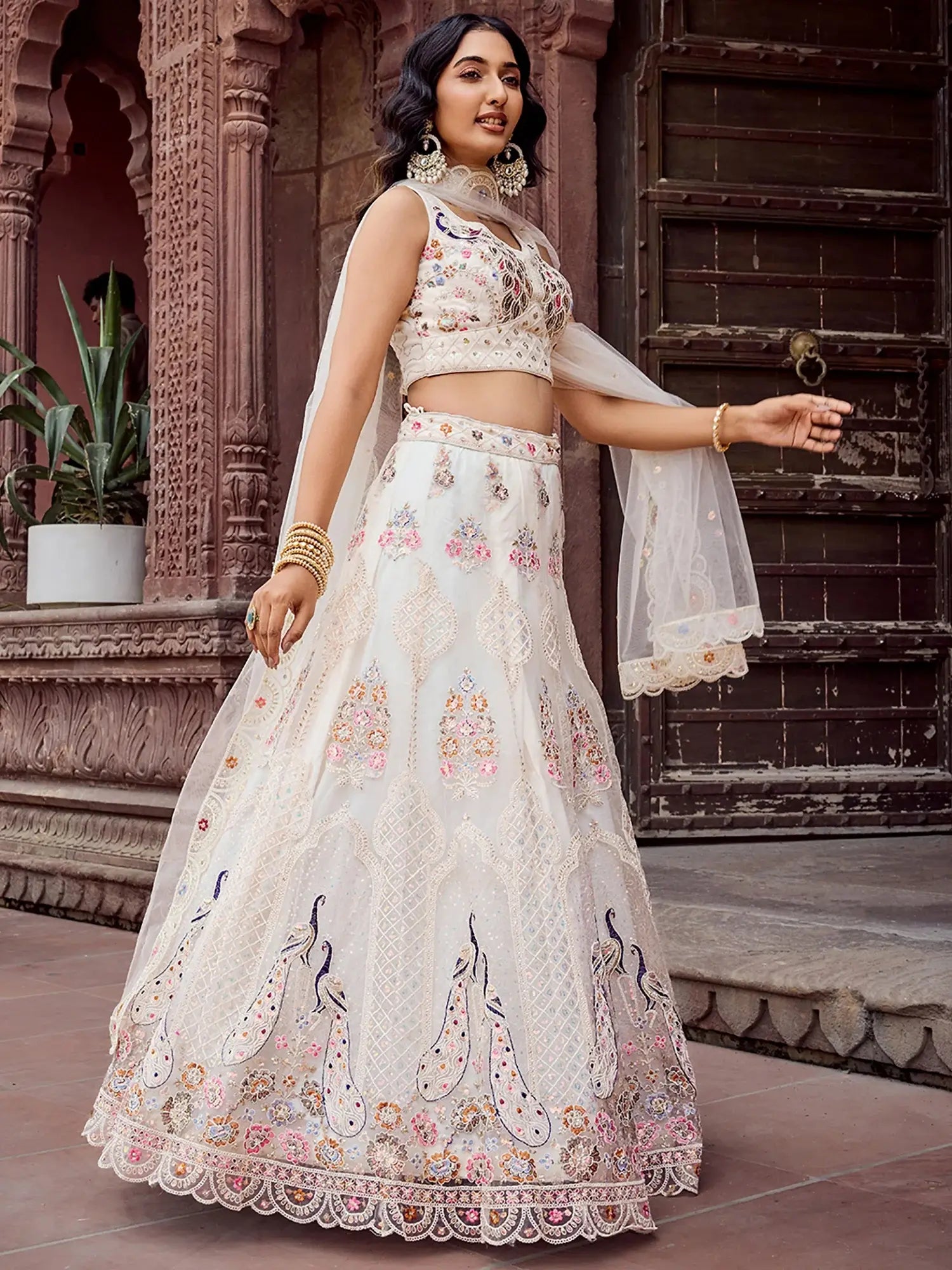 Stunning Cream Sequins Embroidered Net Wedding Wear Lehenga Choli