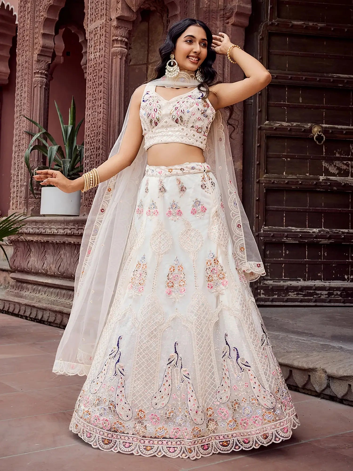 Stunning Cream Sequins Embroidered Net Wedding Wear Lehenga Choli