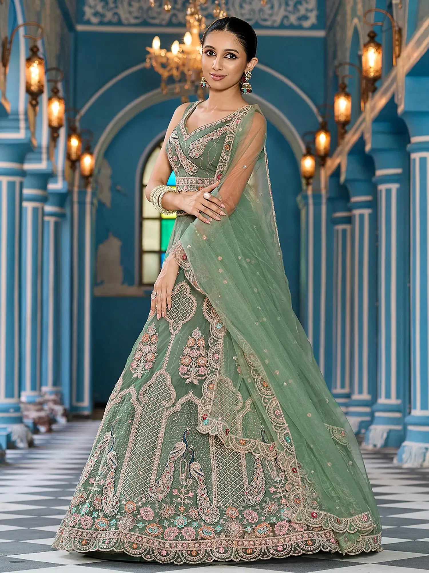 Attractive Green Thread Embroidered Net Engagement Wear Lehenga Choli