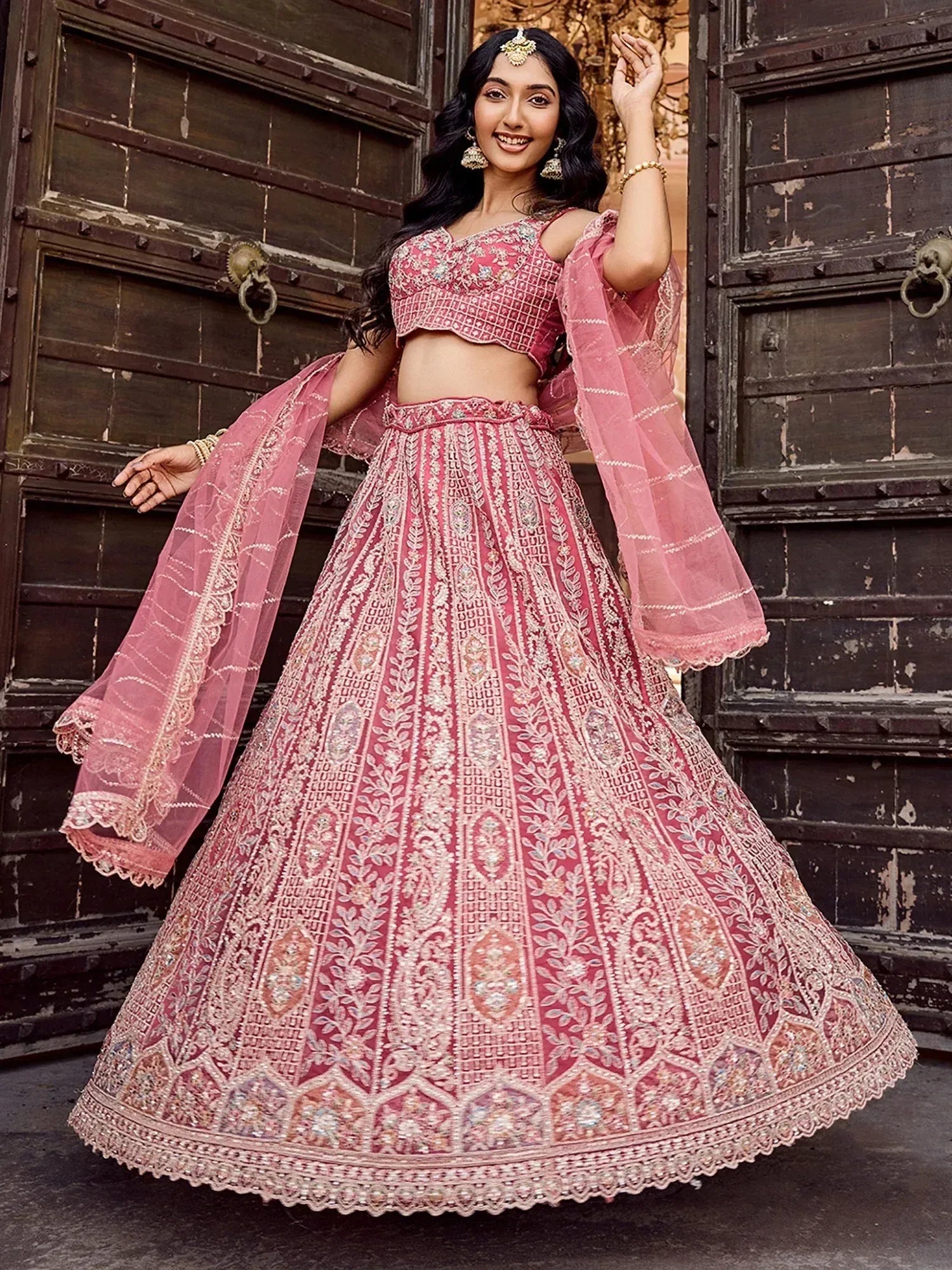 Glowing Rose Gold Sequins Embroidered Net Engagement Lehenga Choli