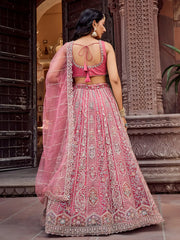 Glowing Rose Gold Sequins Embroidered Net Engagement Lehenga Choli