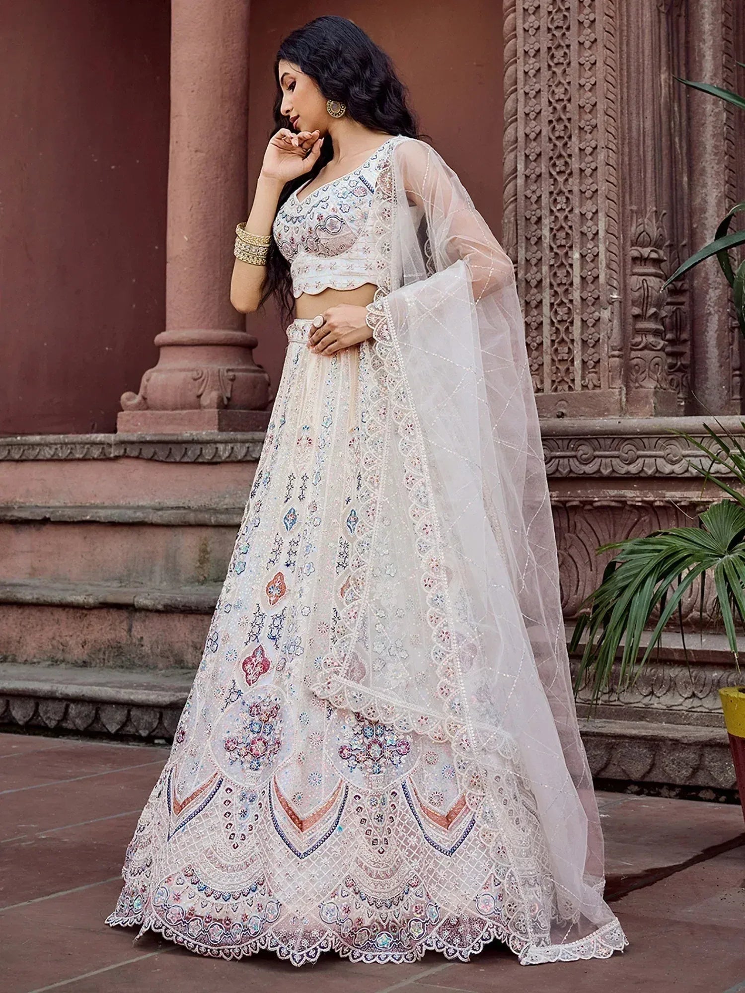 Captivating Cream Thread Embroidered Net Reception Wear Lehenga Choli