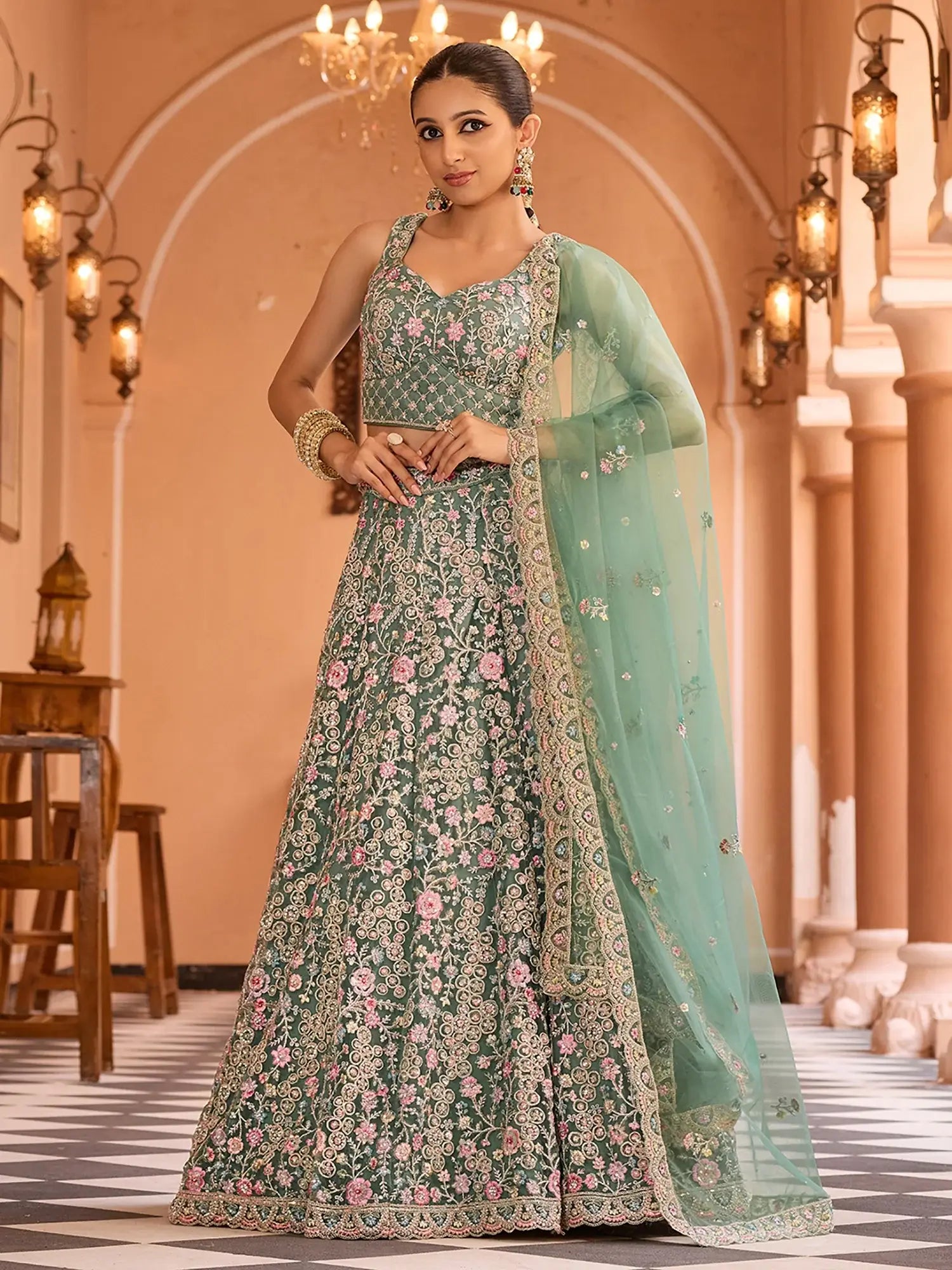 Stunning Pista Sequins Embroidered Net Reception Wear Lehenga Choli
