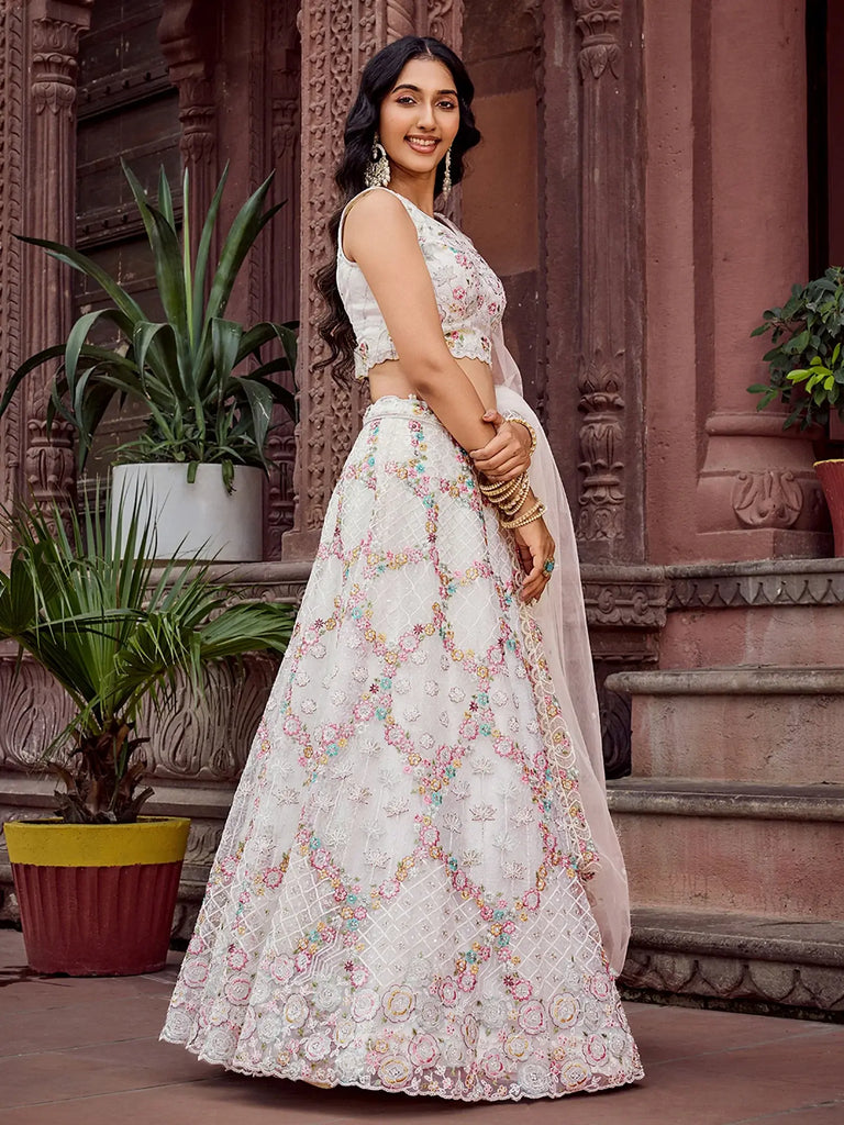 Captivating Cream Sequins Embroidered Net Wedding Wear Lehenga Choli