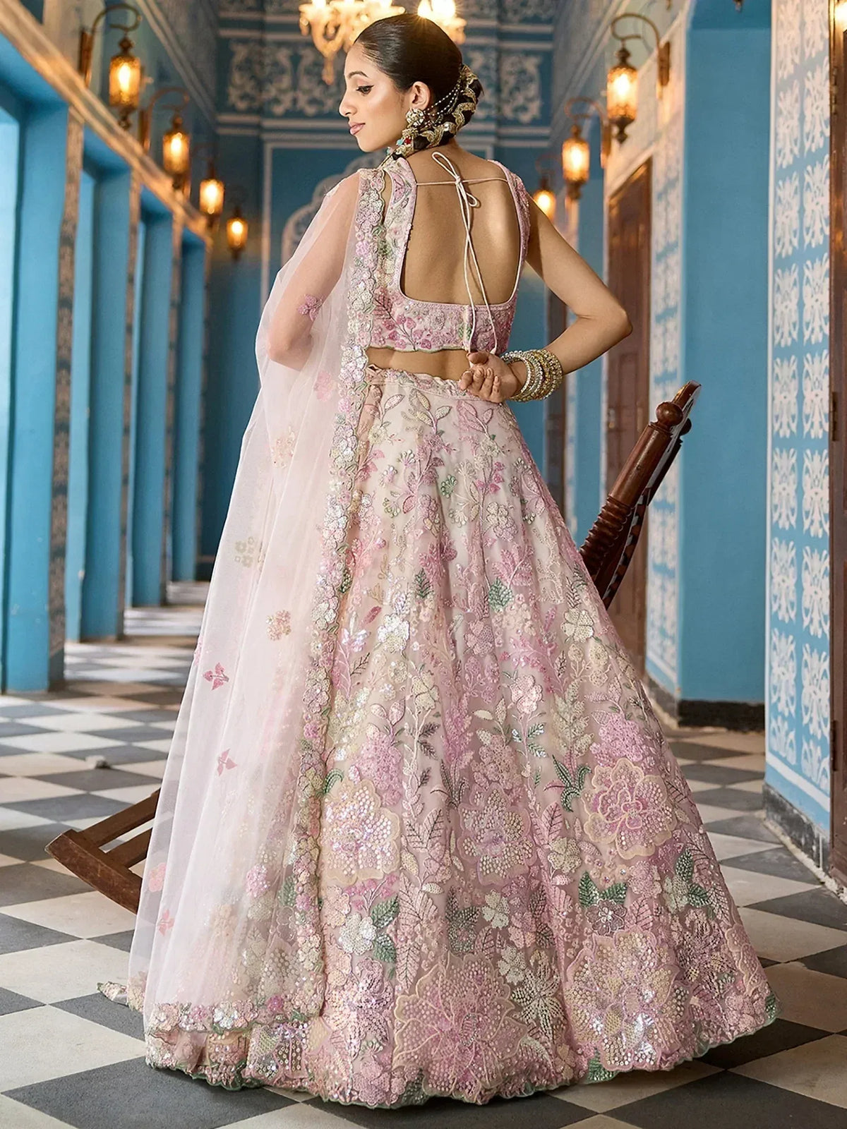 Pink floral embroidered lehenga choli with sheer dupatta, perfect for Indian weddings and festive occasions