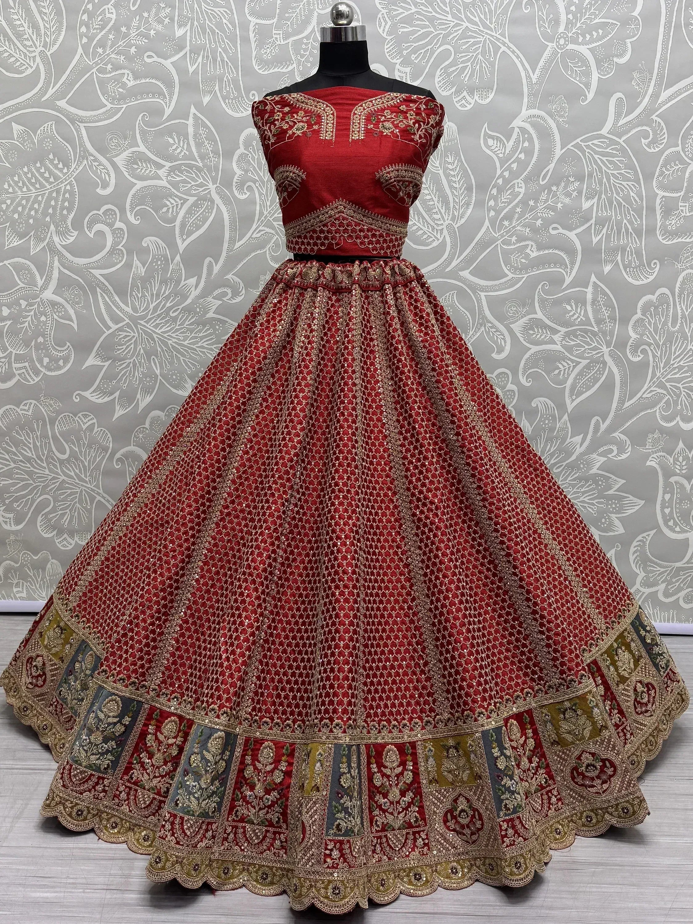 Red designer lehenga choli with gold embroidery, perfect for Indian weddings and festive occasions