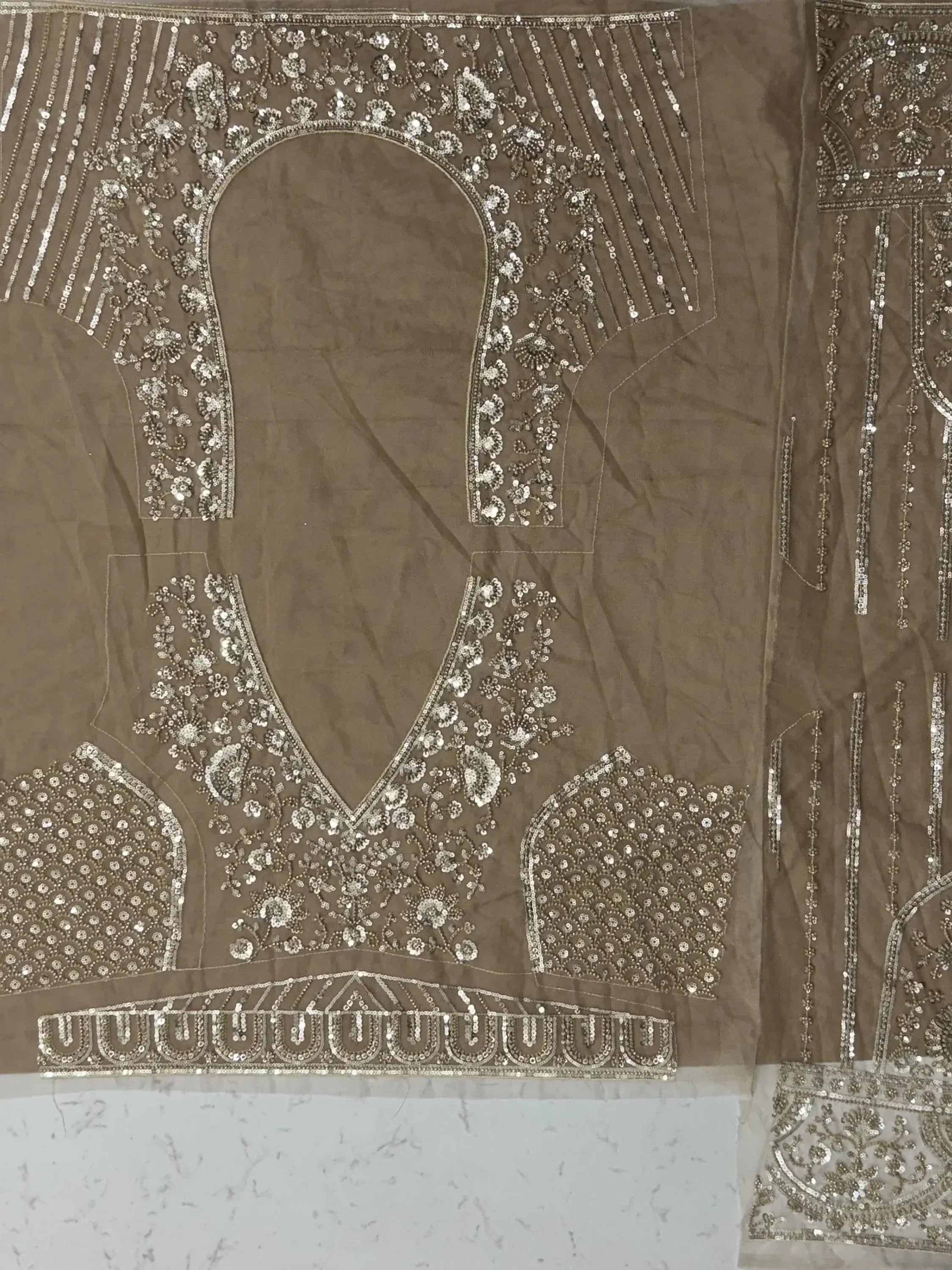 Elegant brown ethnic blouse with intricate silver sequin and floral embroidery, perfect for lehenga choli or saree sets.