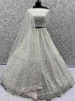 Gleaming White Sequins Net Engagement Wear Lehenga Choli With Dupatta