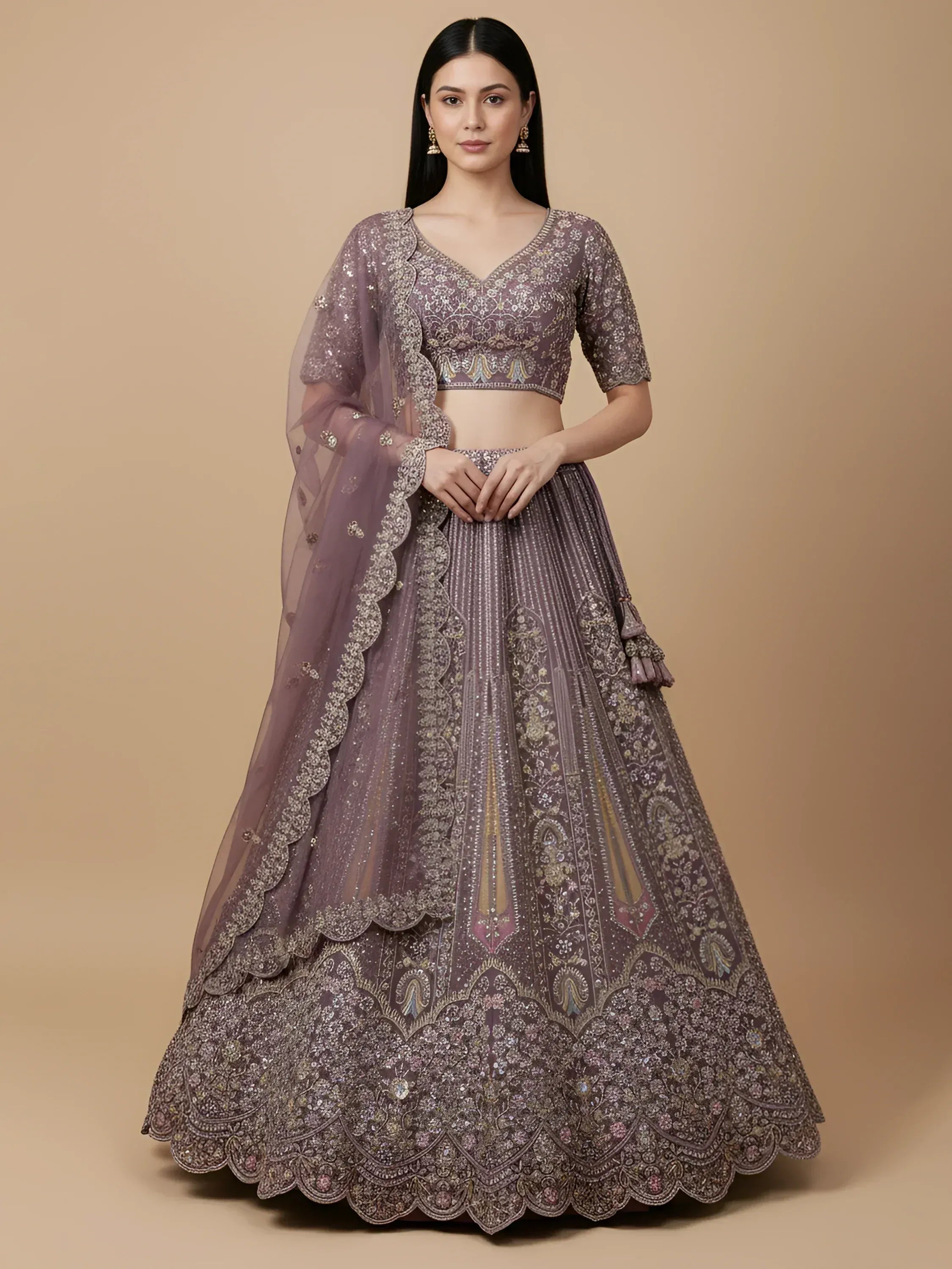 Elegant mauve lehenga choli with intricate embroidery and scalloped dupatta, perfect for Indian weddings and festive occasions.