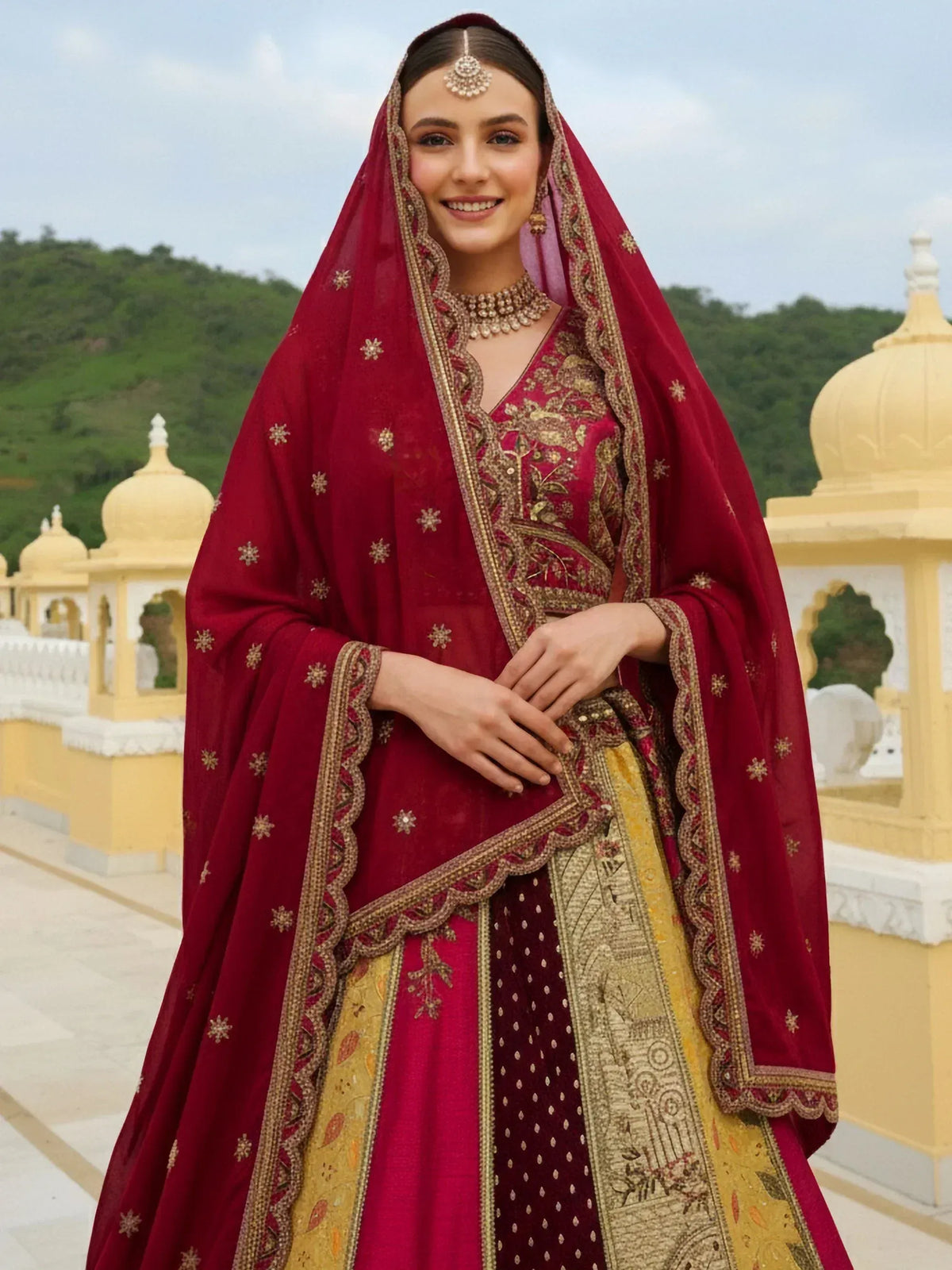 Elegant maroon lehenga choli with gold embroidery, perfect for Indian weddings and festive occasions.
