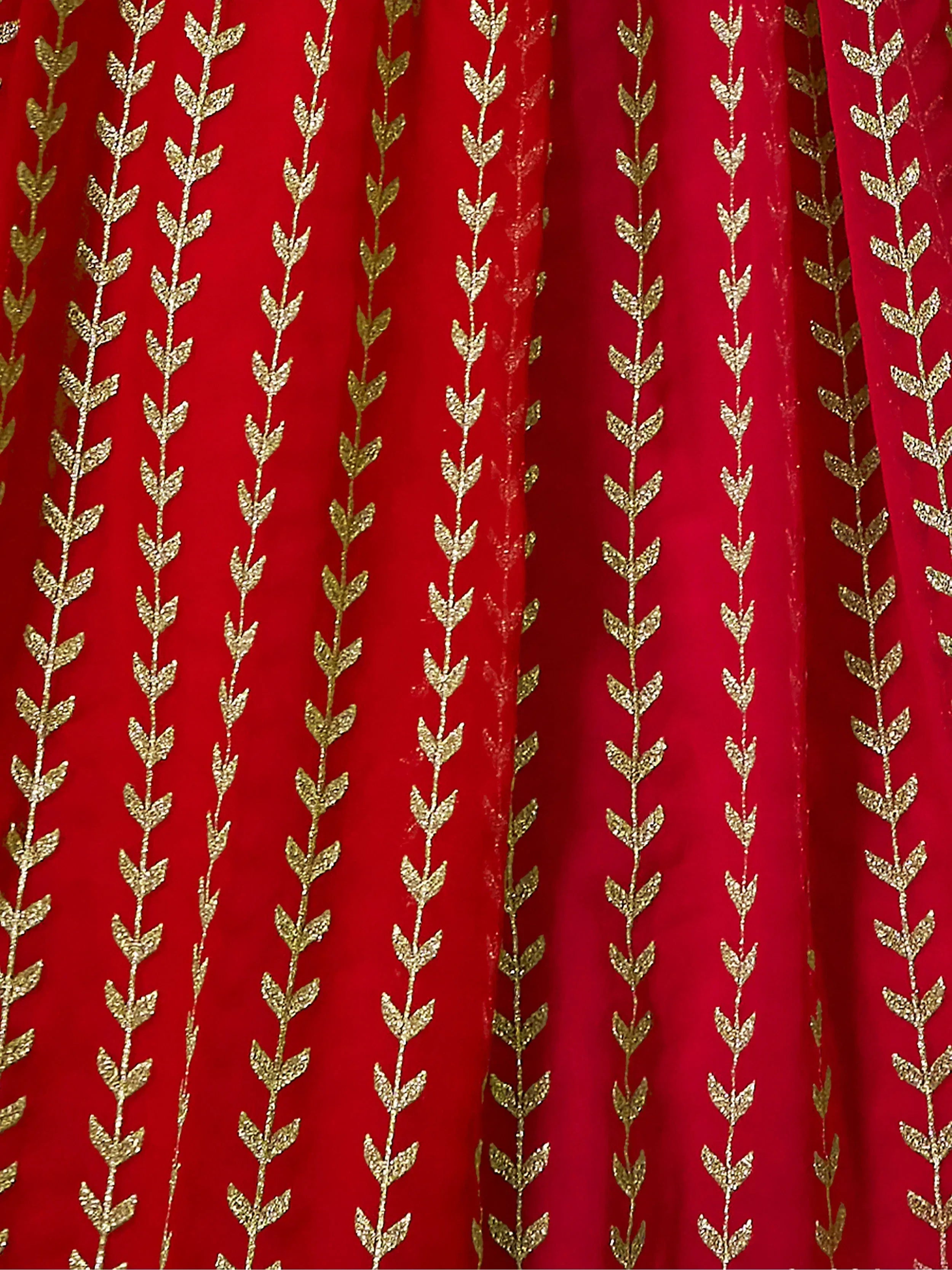 Red ethnic wear fabric with gold leaf embroidery, perfect for designer lehenga or saree