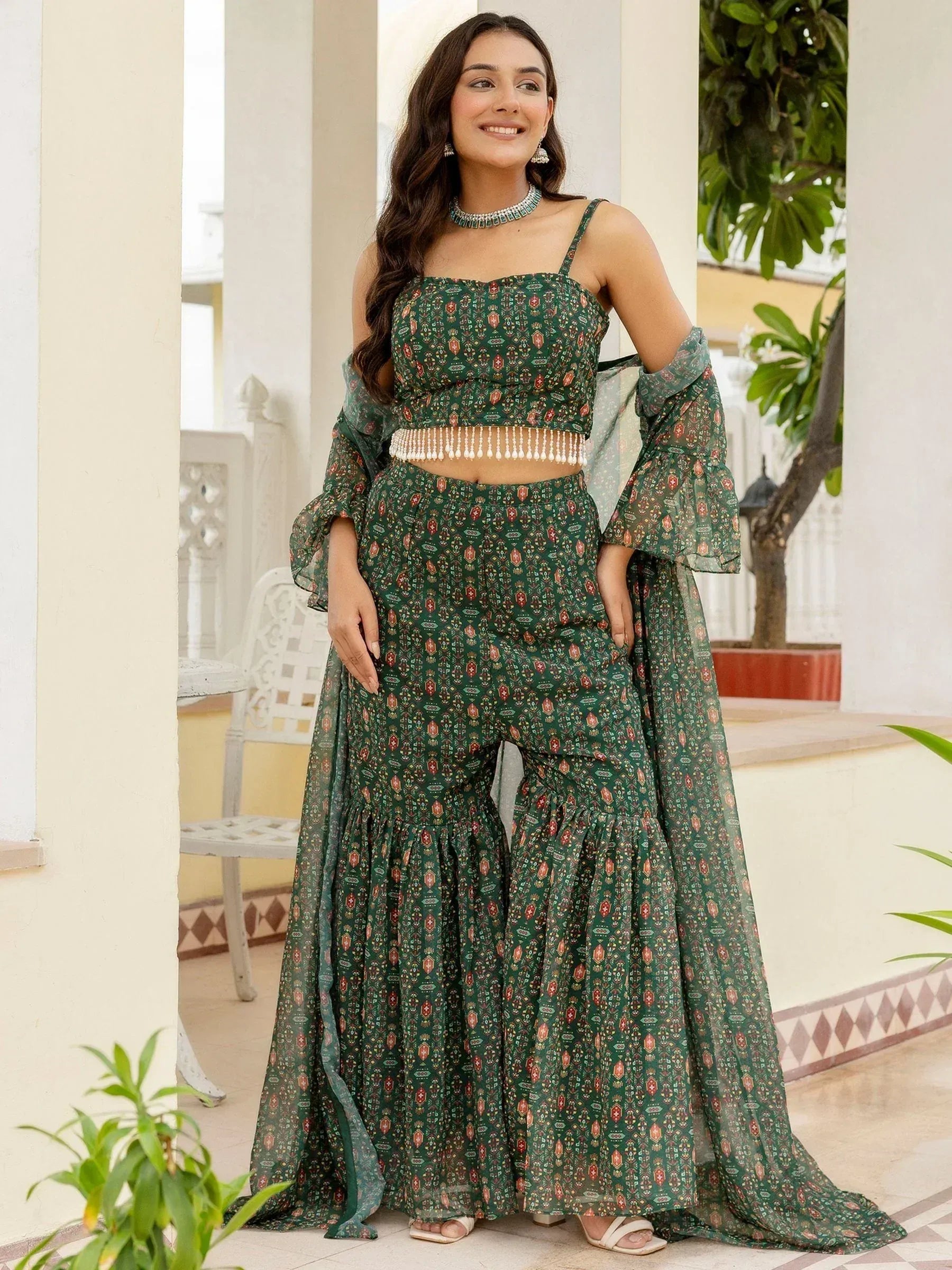 Green printed ethnic palazzo set with crop top and flared sleeves, perfect for Indian occasions