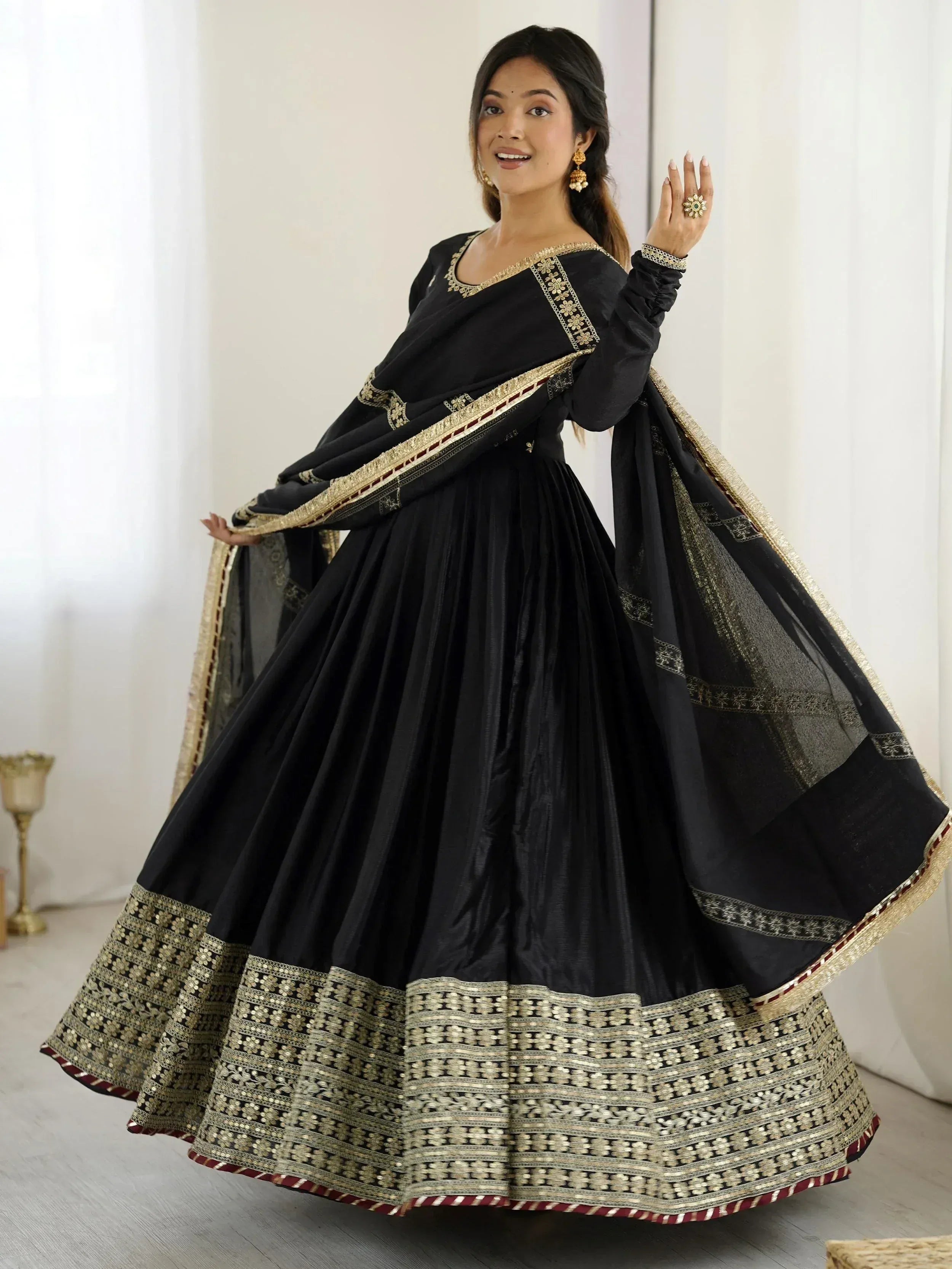 Black ethnic lehenga choli with gold embroidery and border, perfect for Indian festive occasions