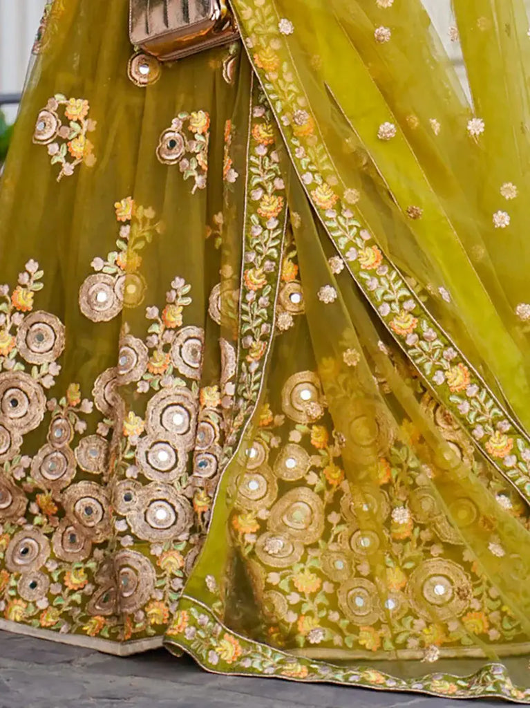 Ravishing Green Mirror Embroidered Net Reception Wear Lehenga Choli