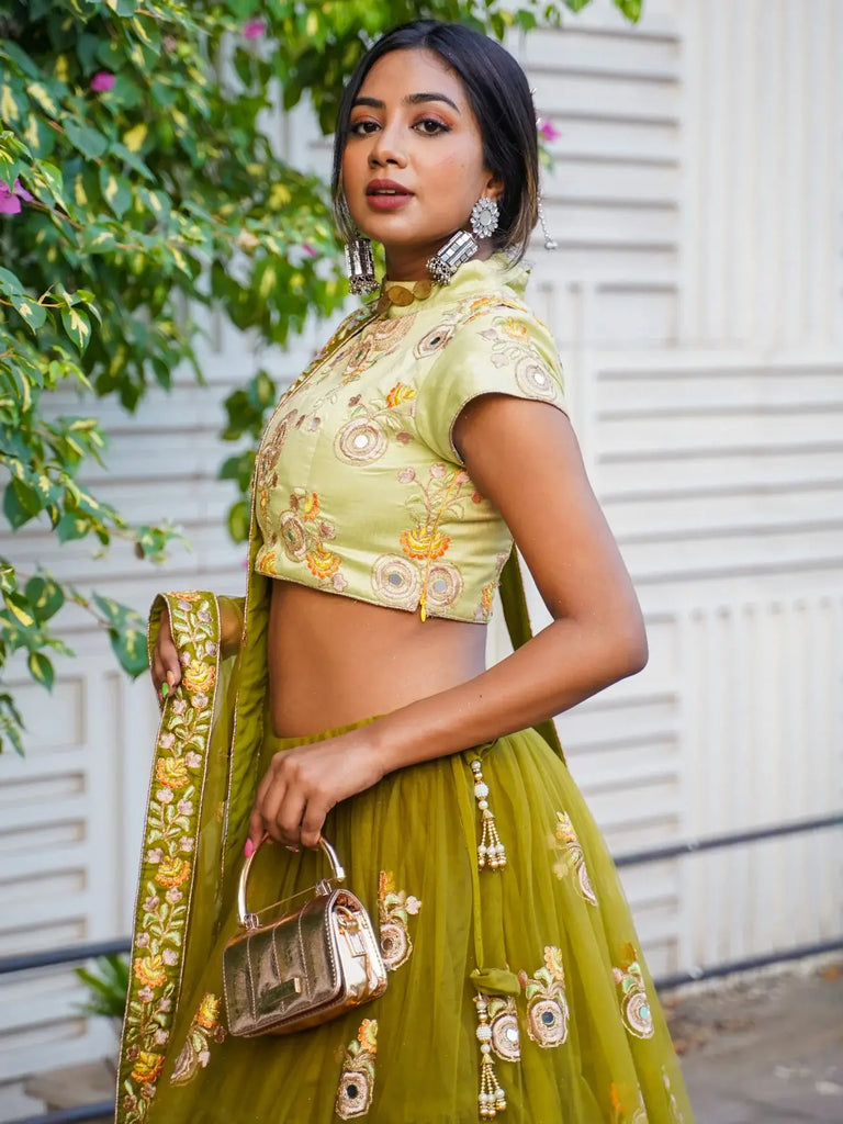 Ravishing Green Mirror Embroidered Net Reception Wear Lehenga Choli