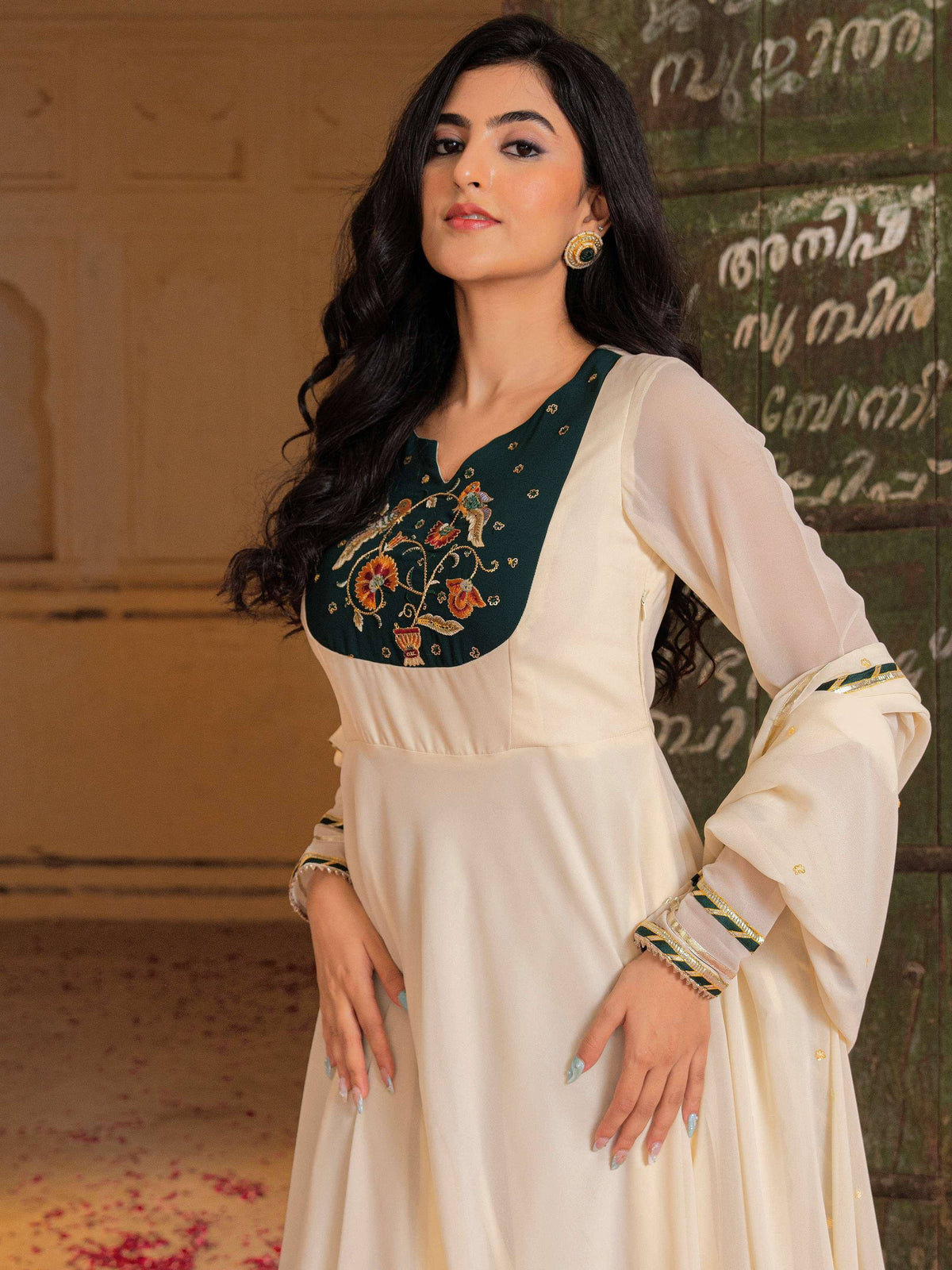 Elegant cream and green embroidered ethnic gown with floral detailing