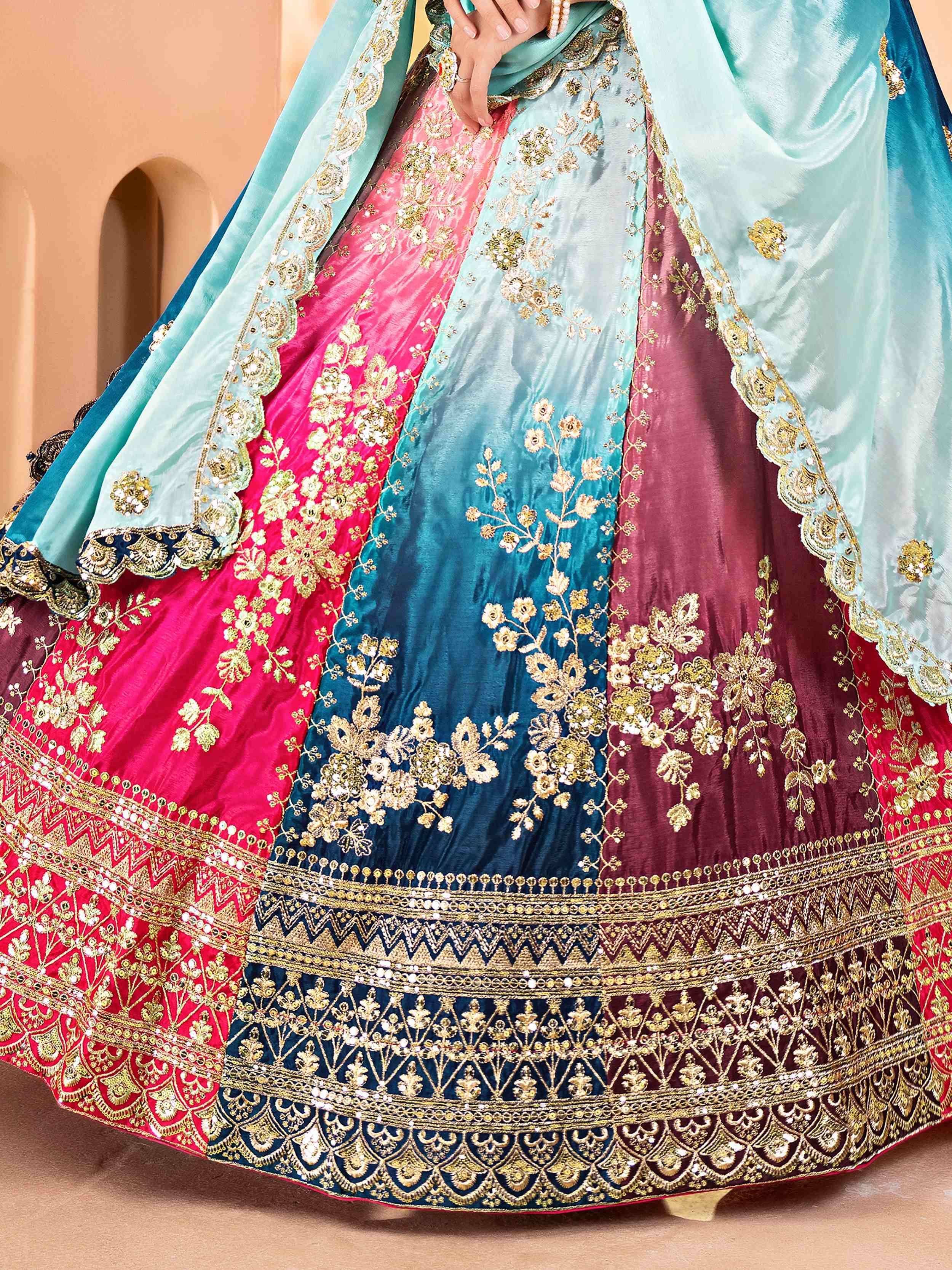 Multicolor embroidered lehenga choli with gold floral work and velvet fabric, perfect for Indian weddings and festive occasions.