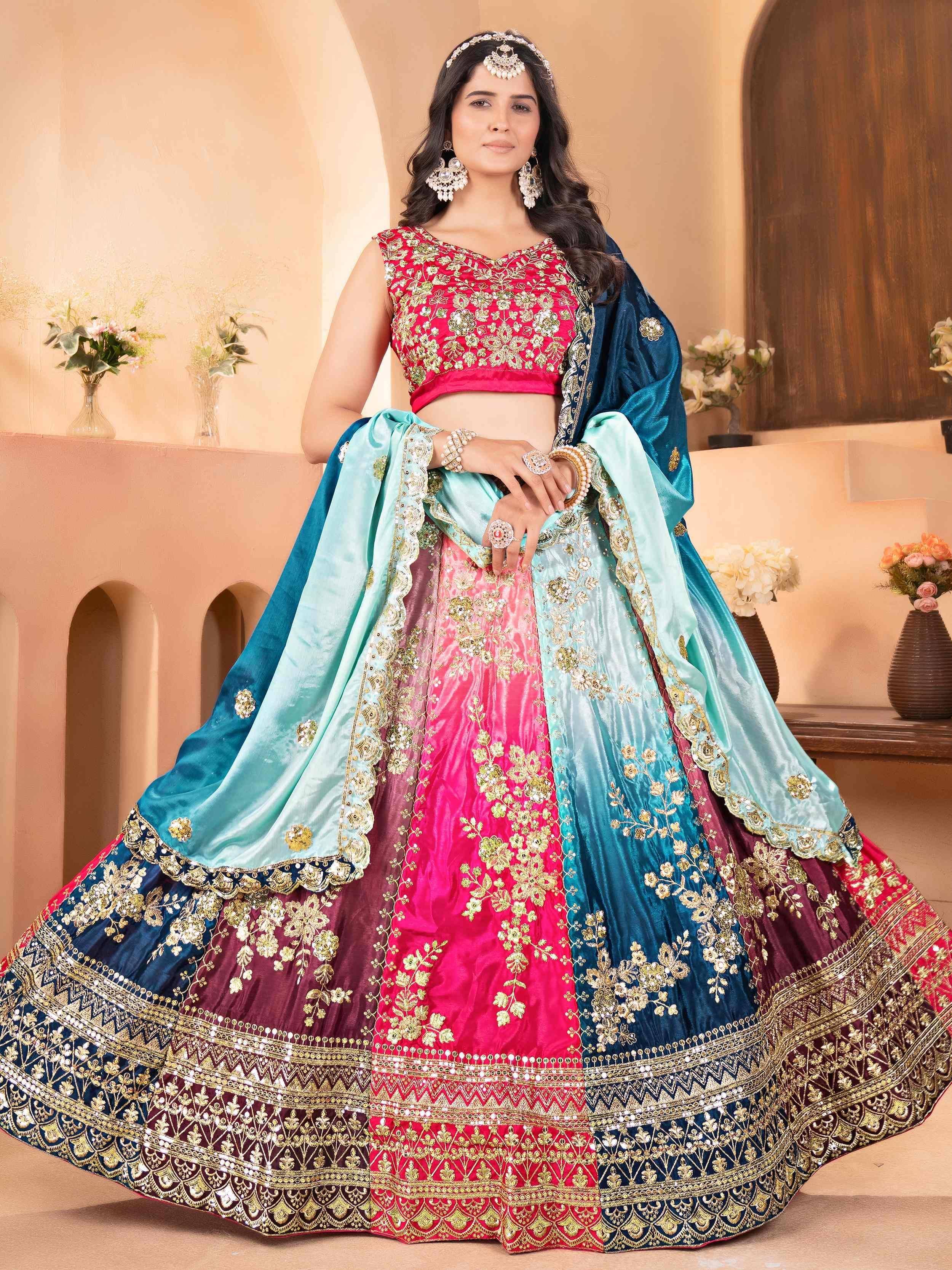 Designer lehenga choli with pink, blue, and maroon panels, gold embroidery, and matching dupatta for Indian ethnic wear