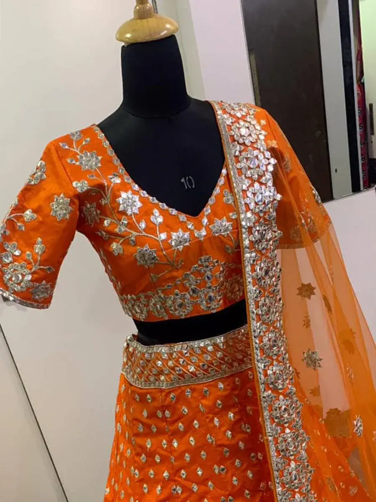 Delicate Orange Zari Work Silk Lehenga Choli With Net Dupatta