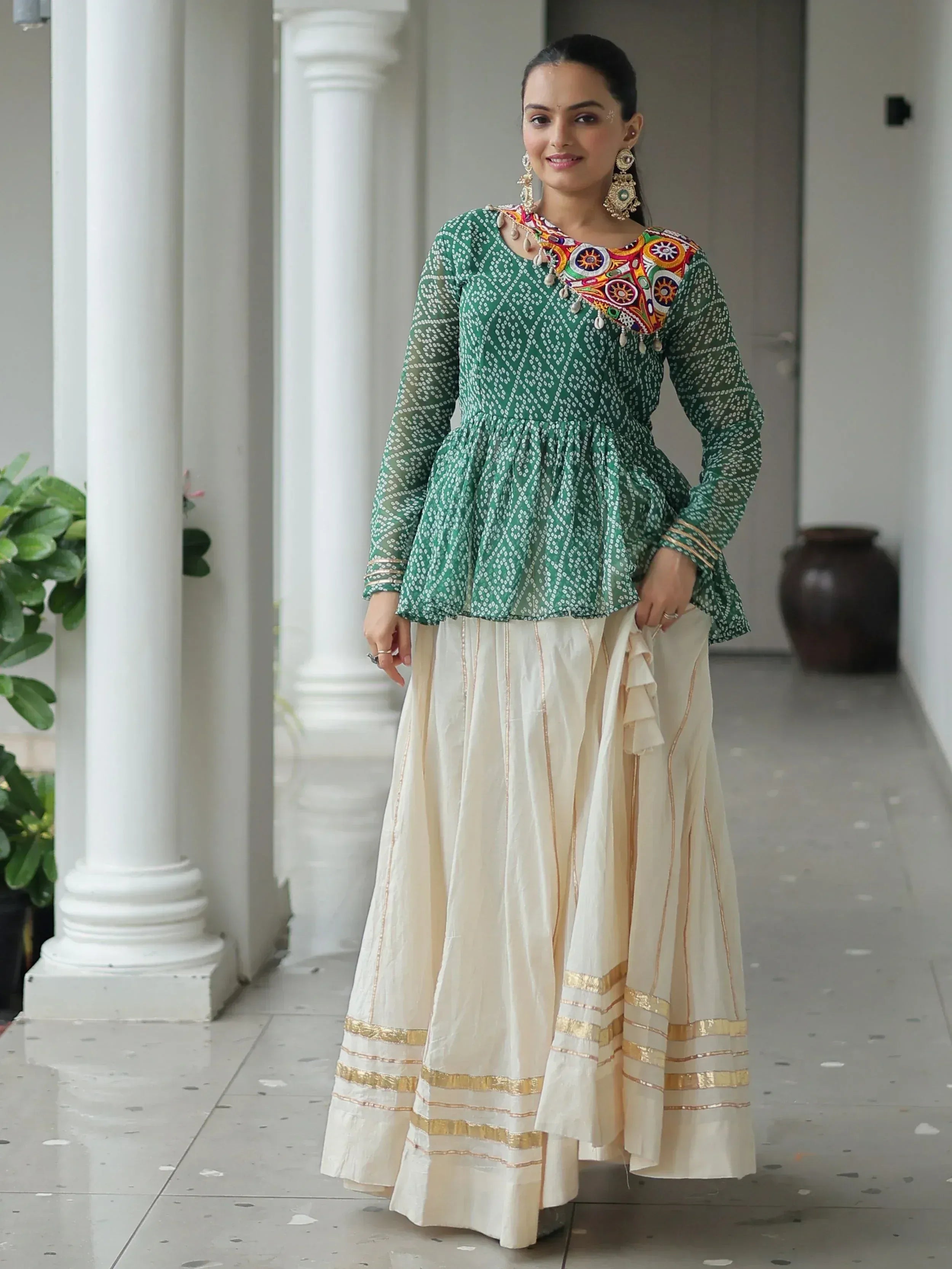 Green embroidered peplum top with cream skirt, Indian ethnic wear for women
