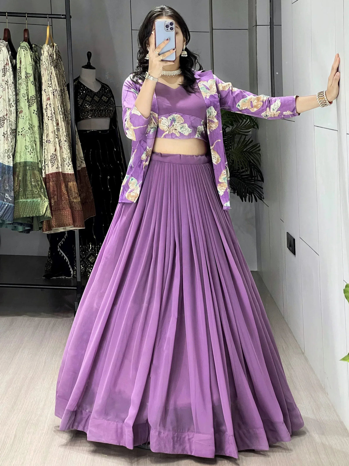 Purple floral lehenga choli with pleated skirt, perfect for Indian ethnic wear and festive occasions.