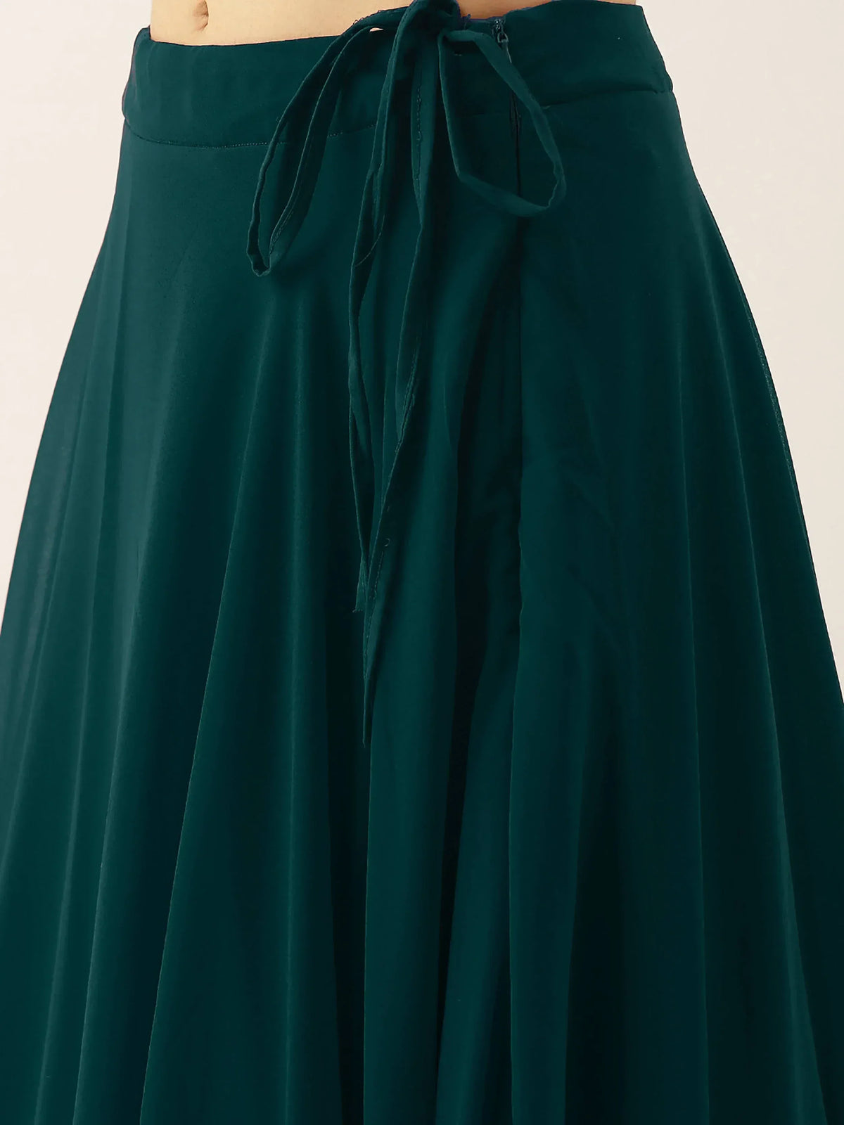 Emerald green ethnic skirt with tie waist, perfect for Indian wear and festive occasions.