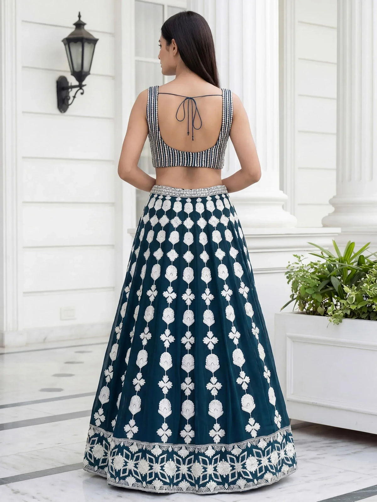 Teal lehenga choli with white floral embroidery, back view, designer ethnic wear
