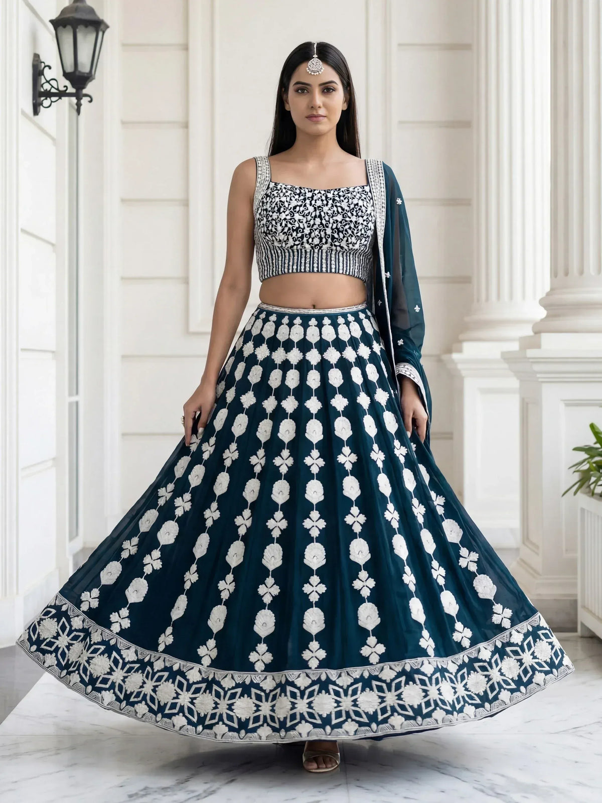 Teal and white embroidered lehenga choli with floral motifs, perfect for Indian ethnic wear occasions