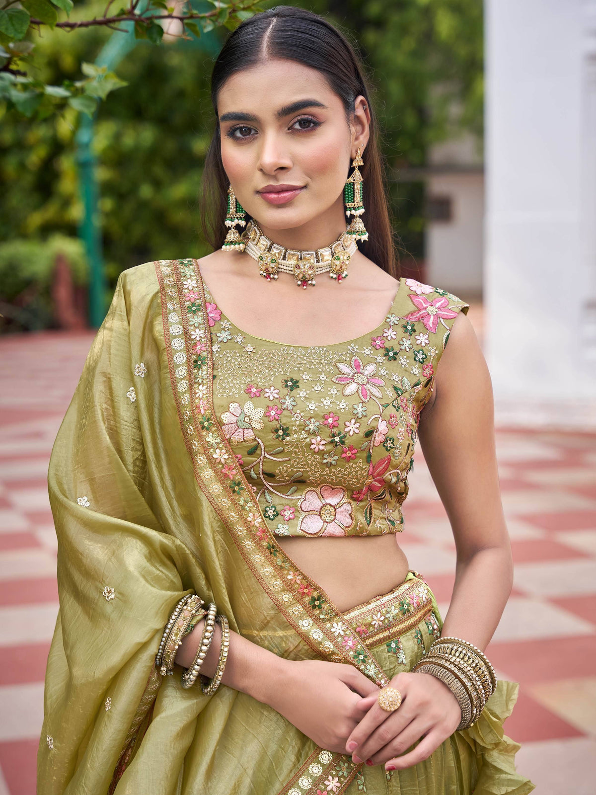 Olive green embroidered lehenga choli with floral motifs, perfect for Indian ethnic wear occasions.