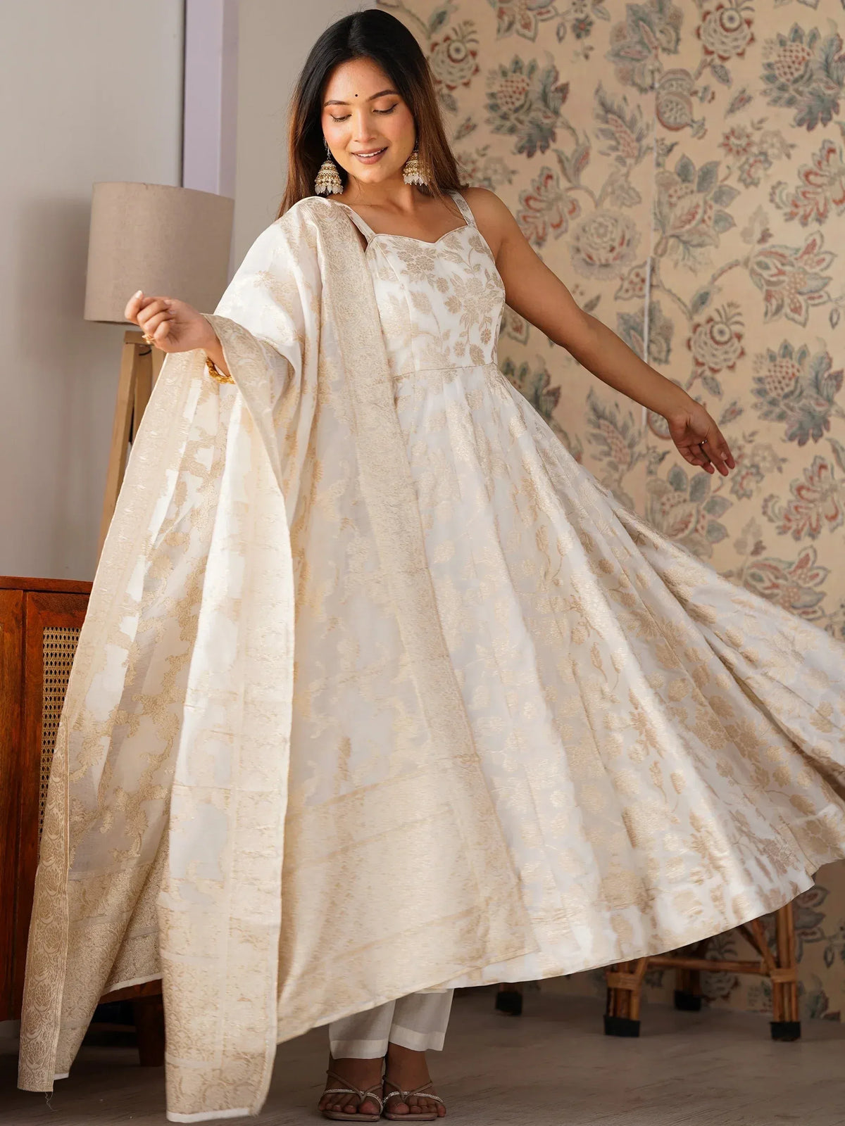 White and gold floral printed ethnic gown with cape, perfect for festive occasions and weddings