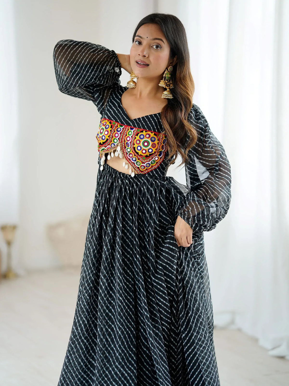 Black and white striped ethnic gown with colorful mirror work and puff sleeves