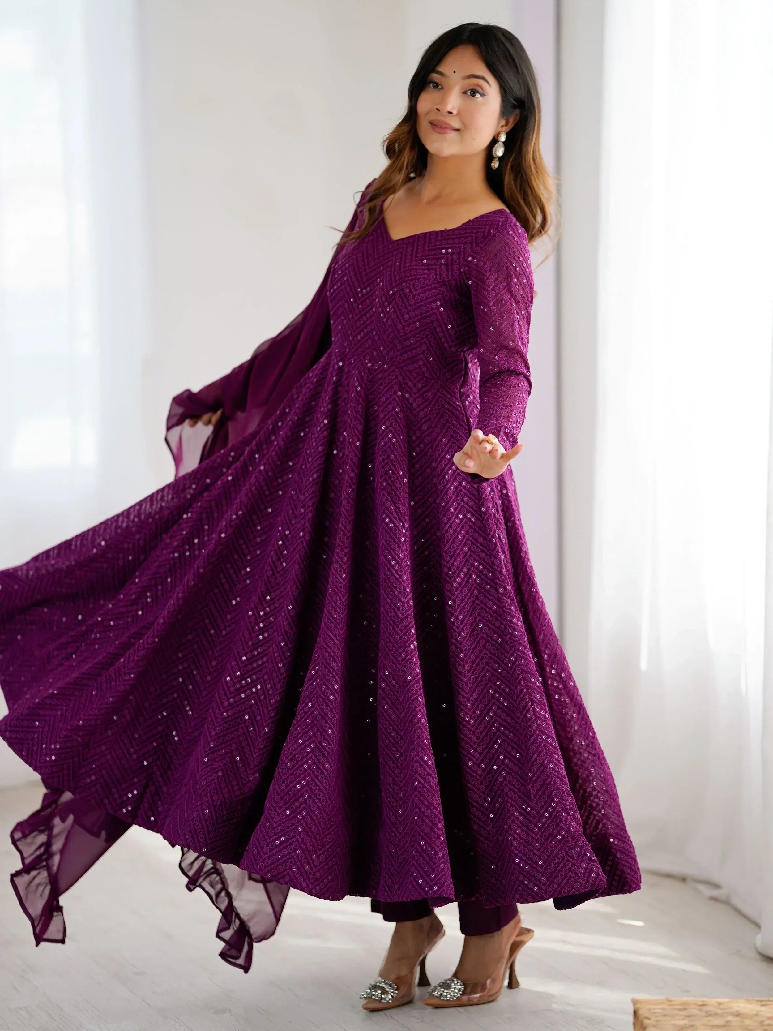 Purple sequin ethnic gown with flared skirt and matching dupatta, perfect for Indian occasions
